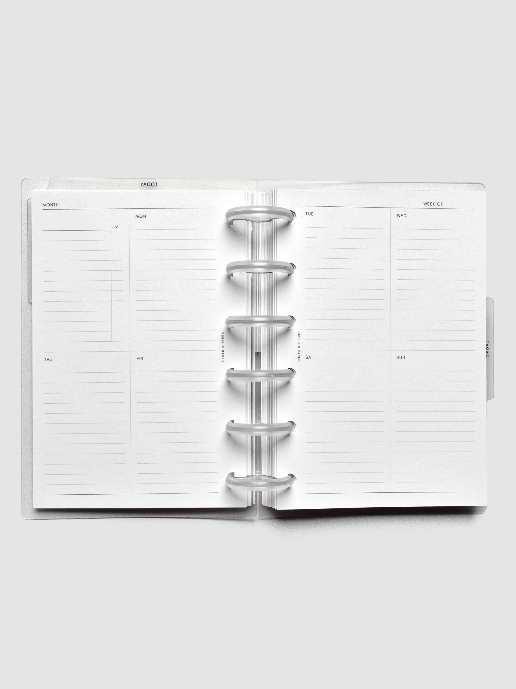 Open discbound planner showing an undated weekly layout.