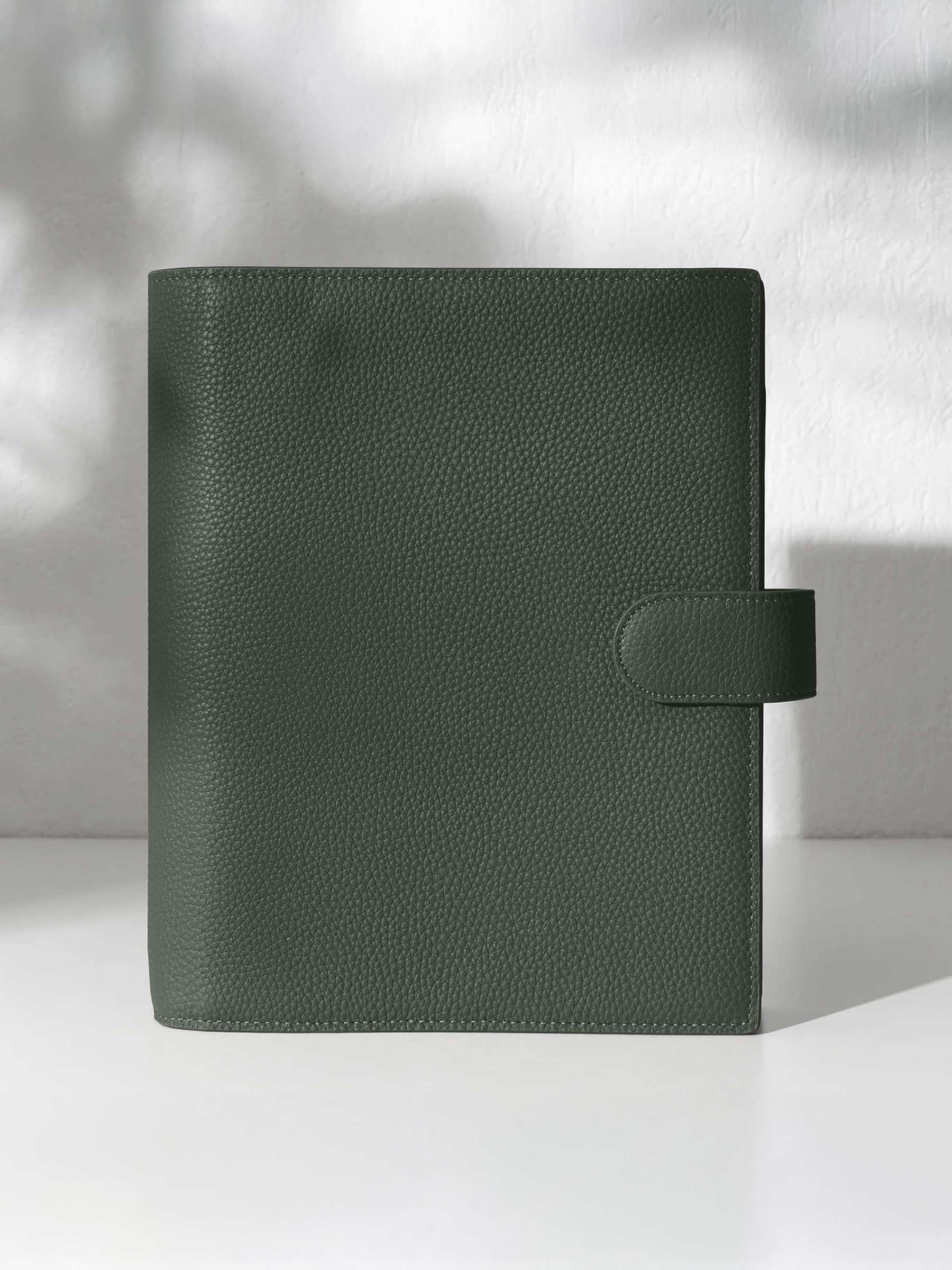 Cypress leather agenda displayed against a shadowed background.