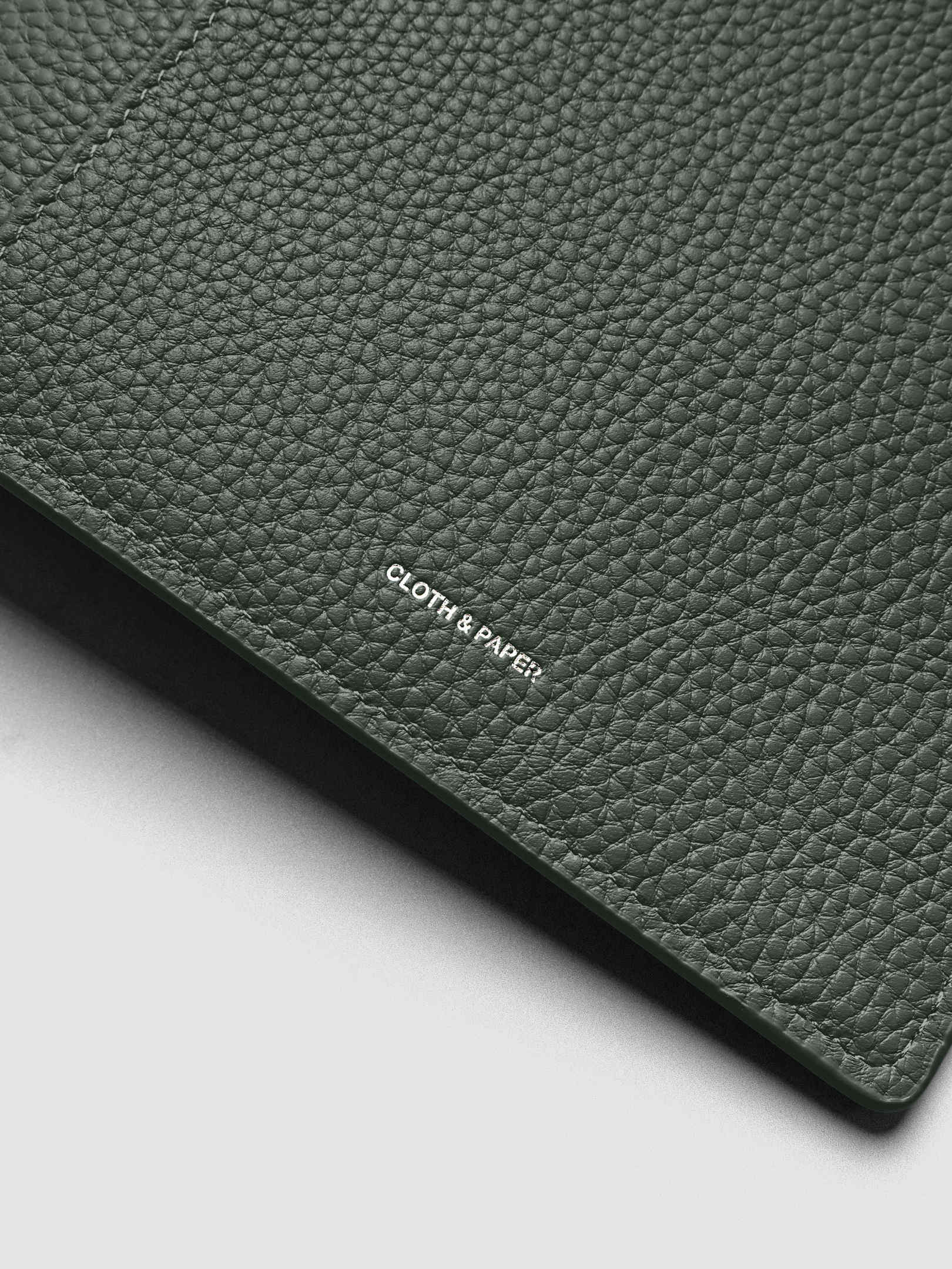 Close up of the Leather Agenda with silver Cloth & Paper logo embossing.