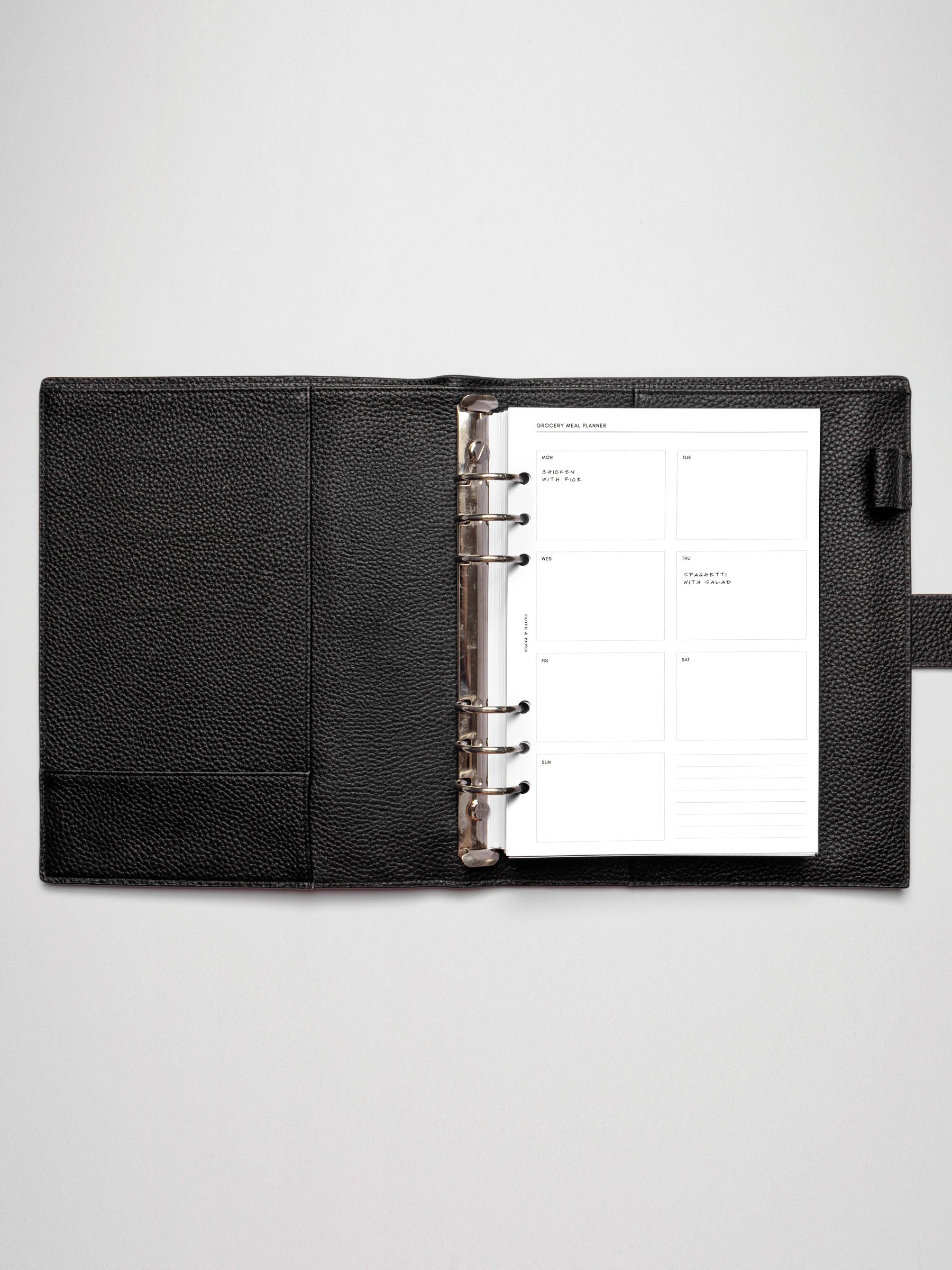 Grocery Meal Planner Insert inside an opened planner.