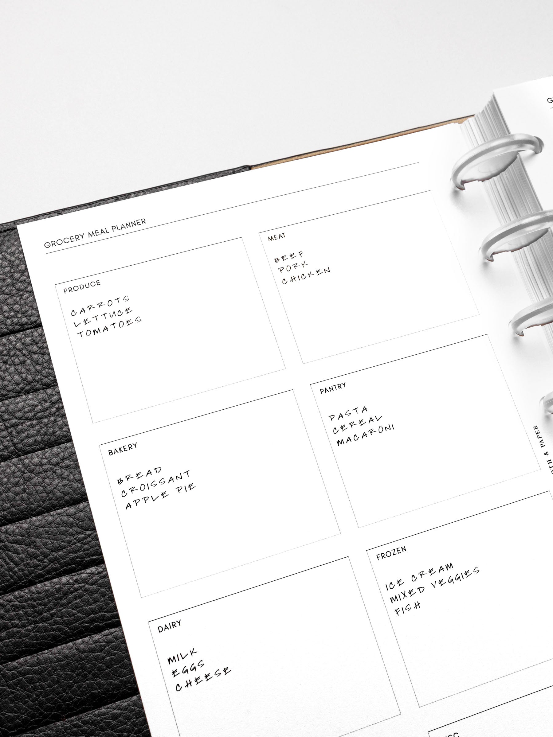 Closeup of a Grocery Meal Planner Insert inside a planner.