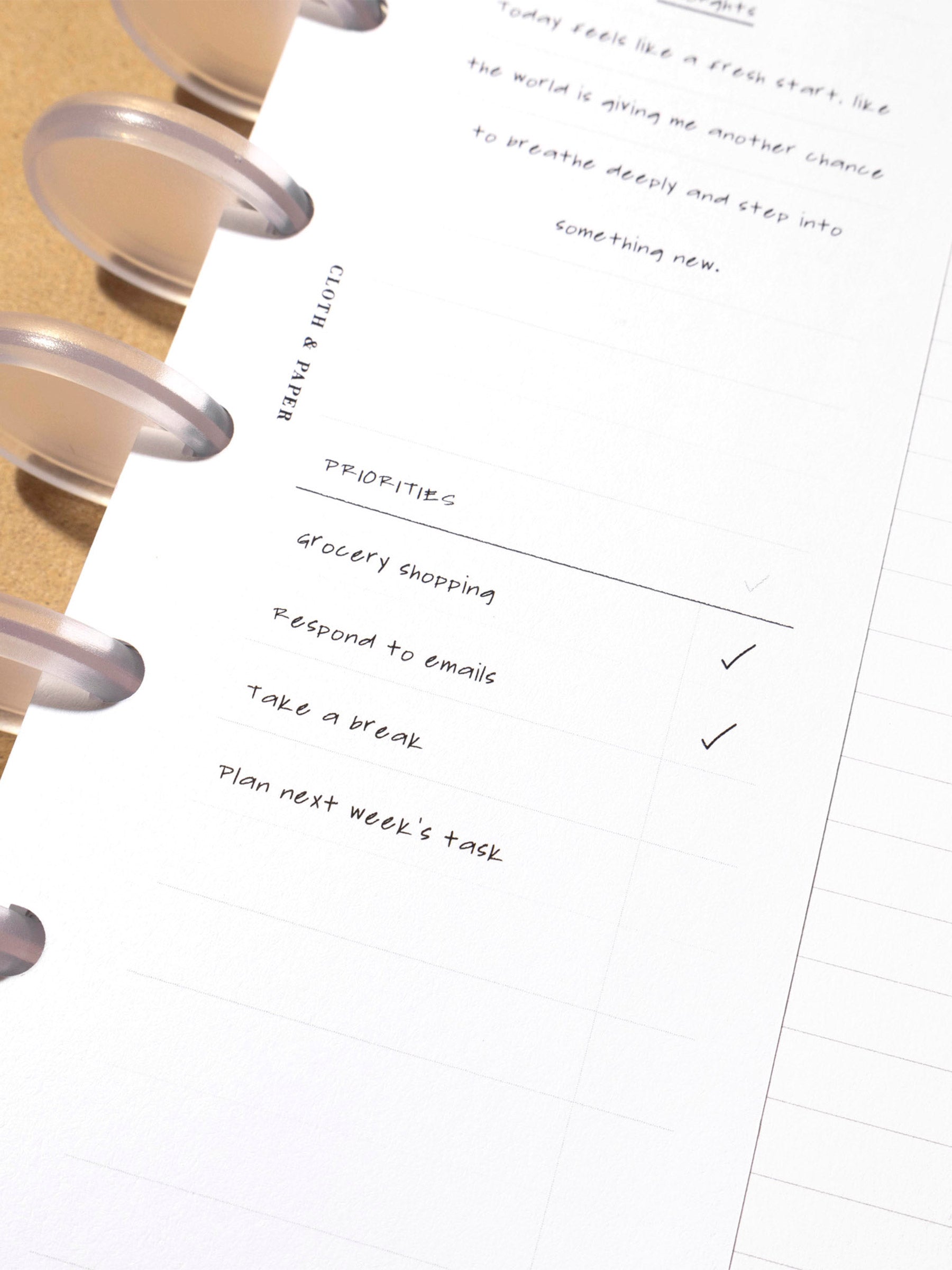 Insert in use inside a leather planner. It has sample text filled out.