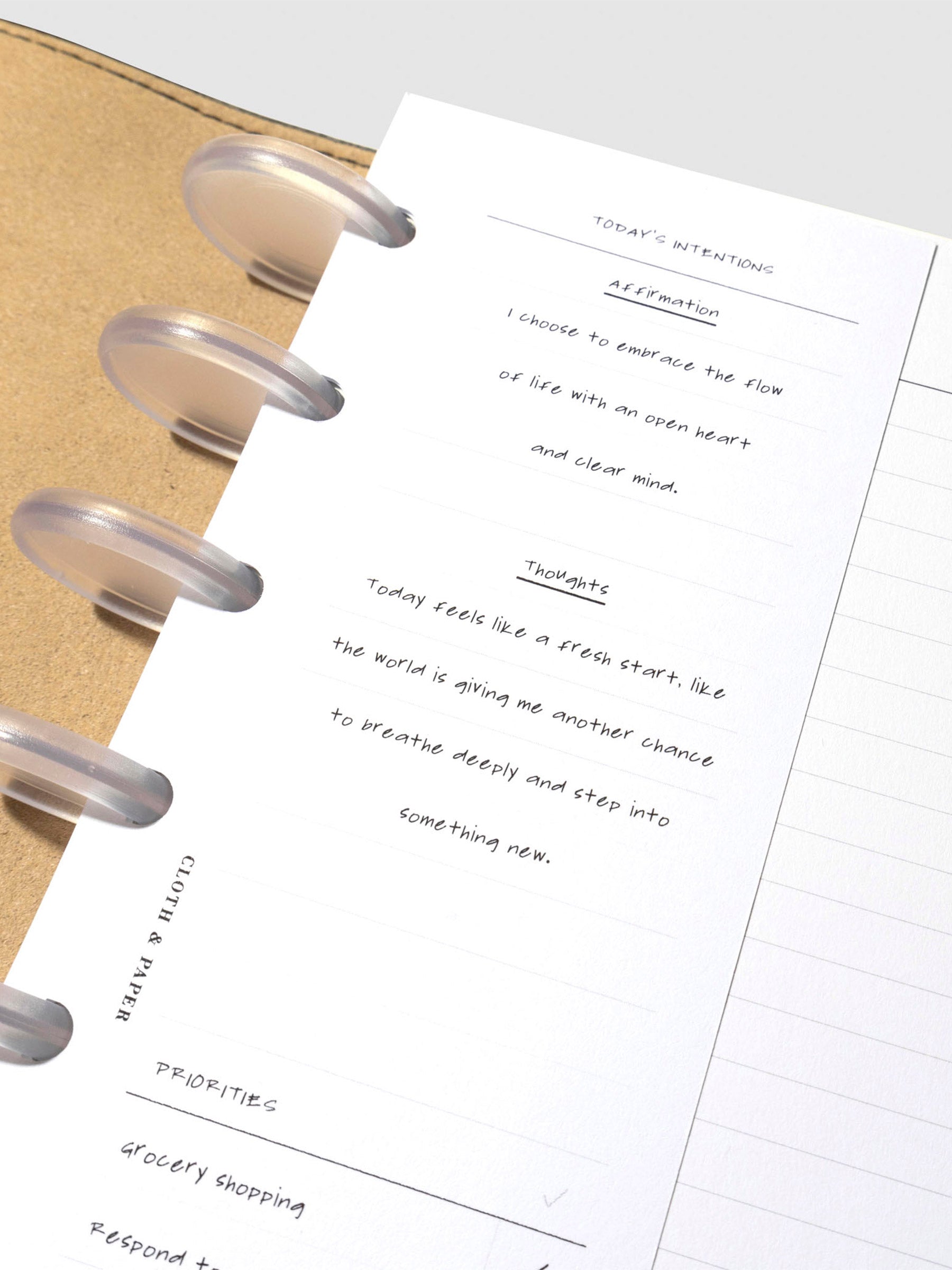 Insert in use inside a leather planner. It has sample text filled out.