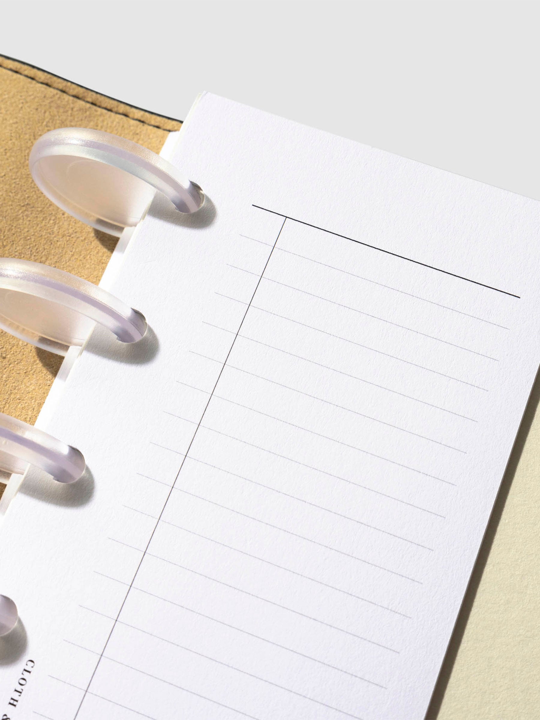 Closeup of insert in use inside a leather planner.