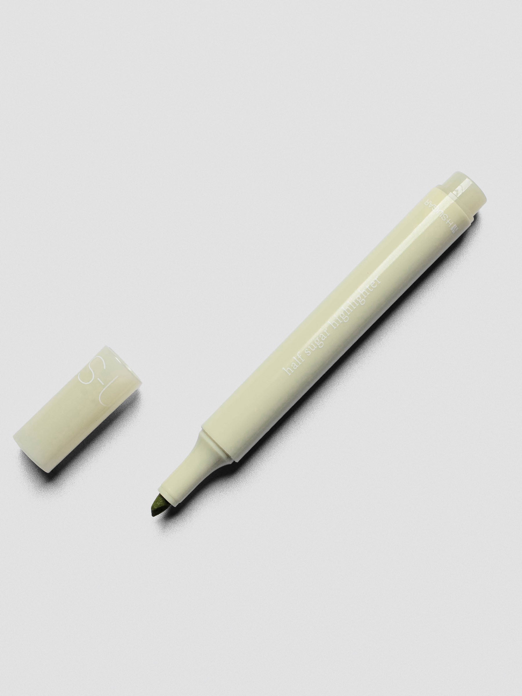Half Sugar Highlighters shown in Green with cap off beside the body of the highlighter.