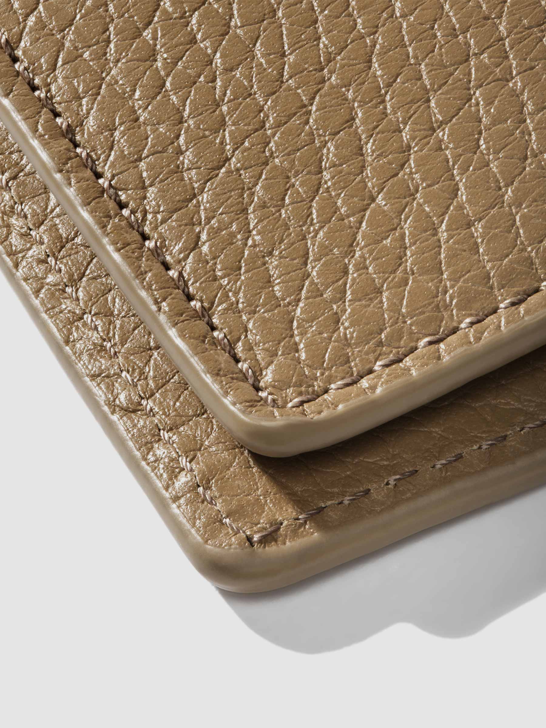 Closeup of Catalonia folio showing the stitching and glazing.