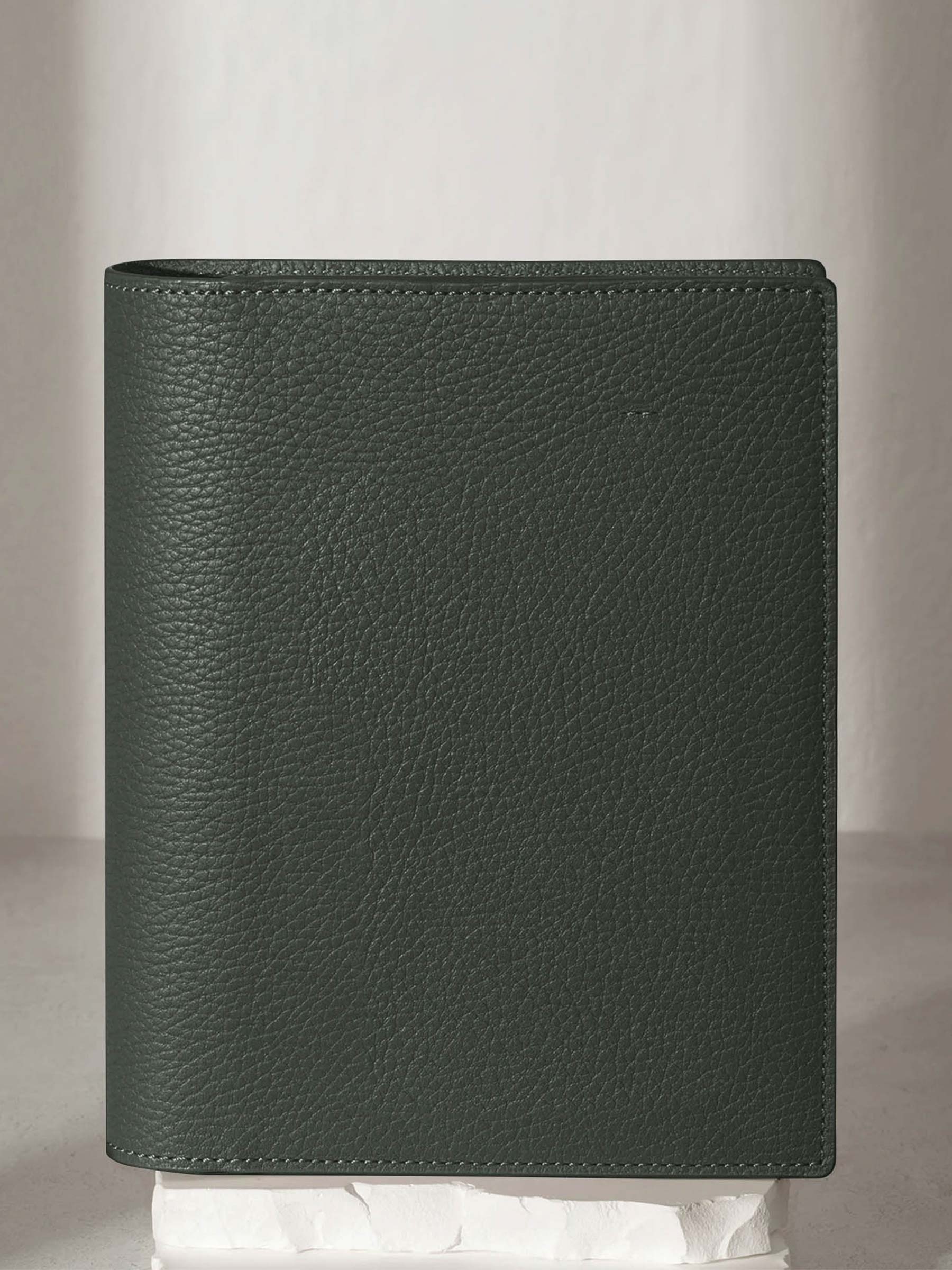 Small folio displayed on a neutral background.