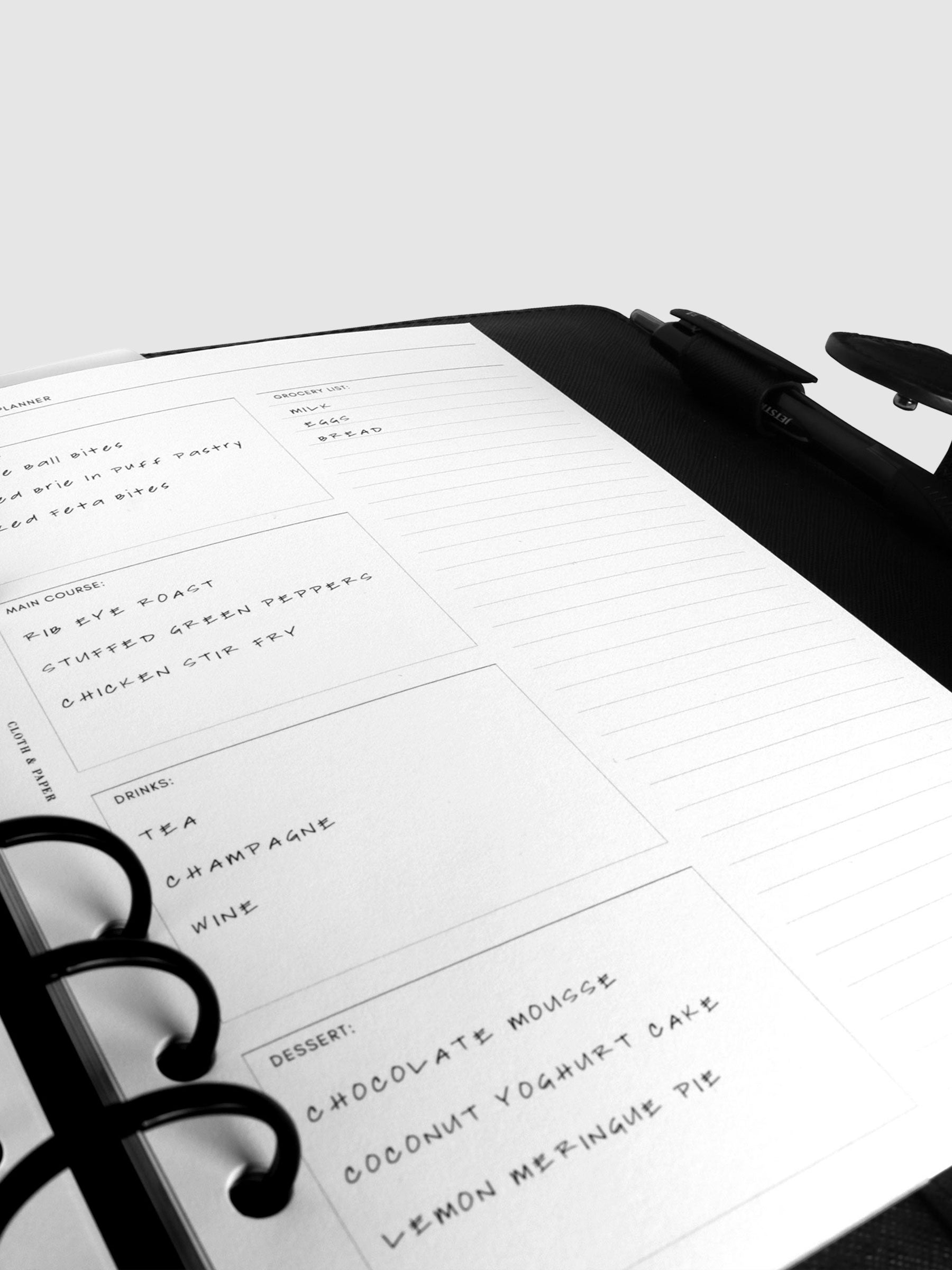 Inserts in use inside a black leather agenda.