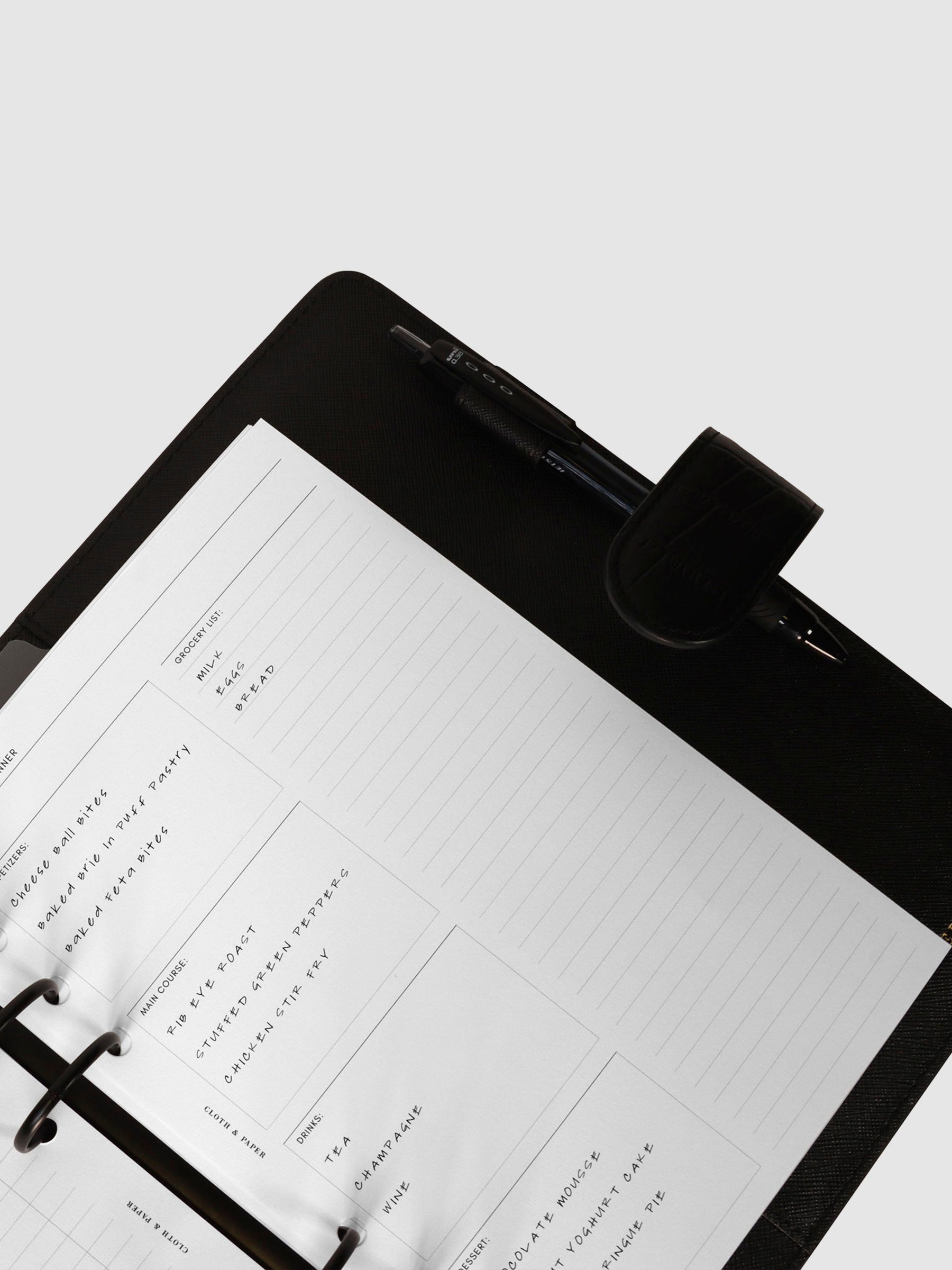 Inserts in use inside a black leather agenda.