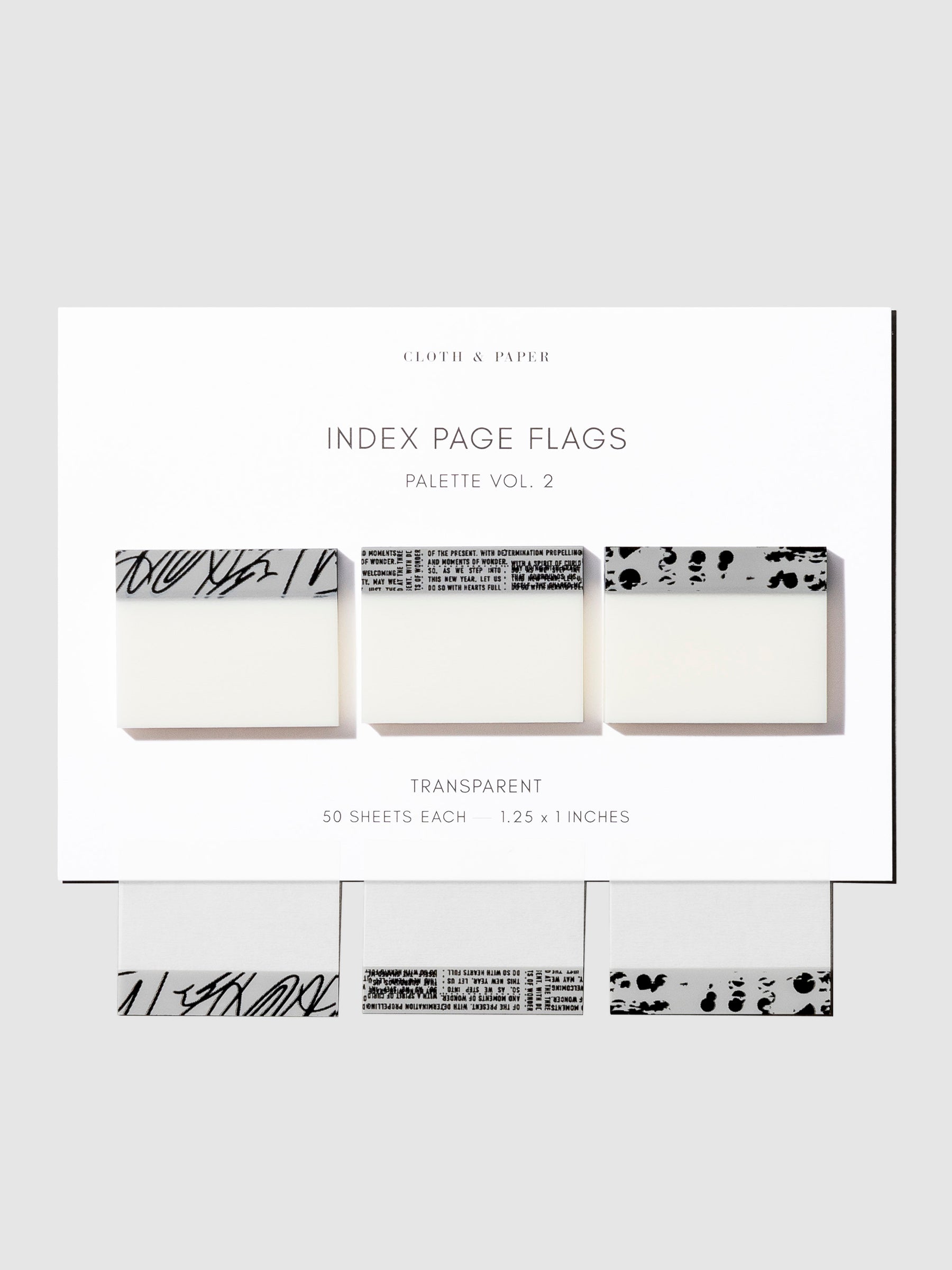 Page flags displayed on a neutral background. One of each color is attached to the backing to show each page flag's transparency.