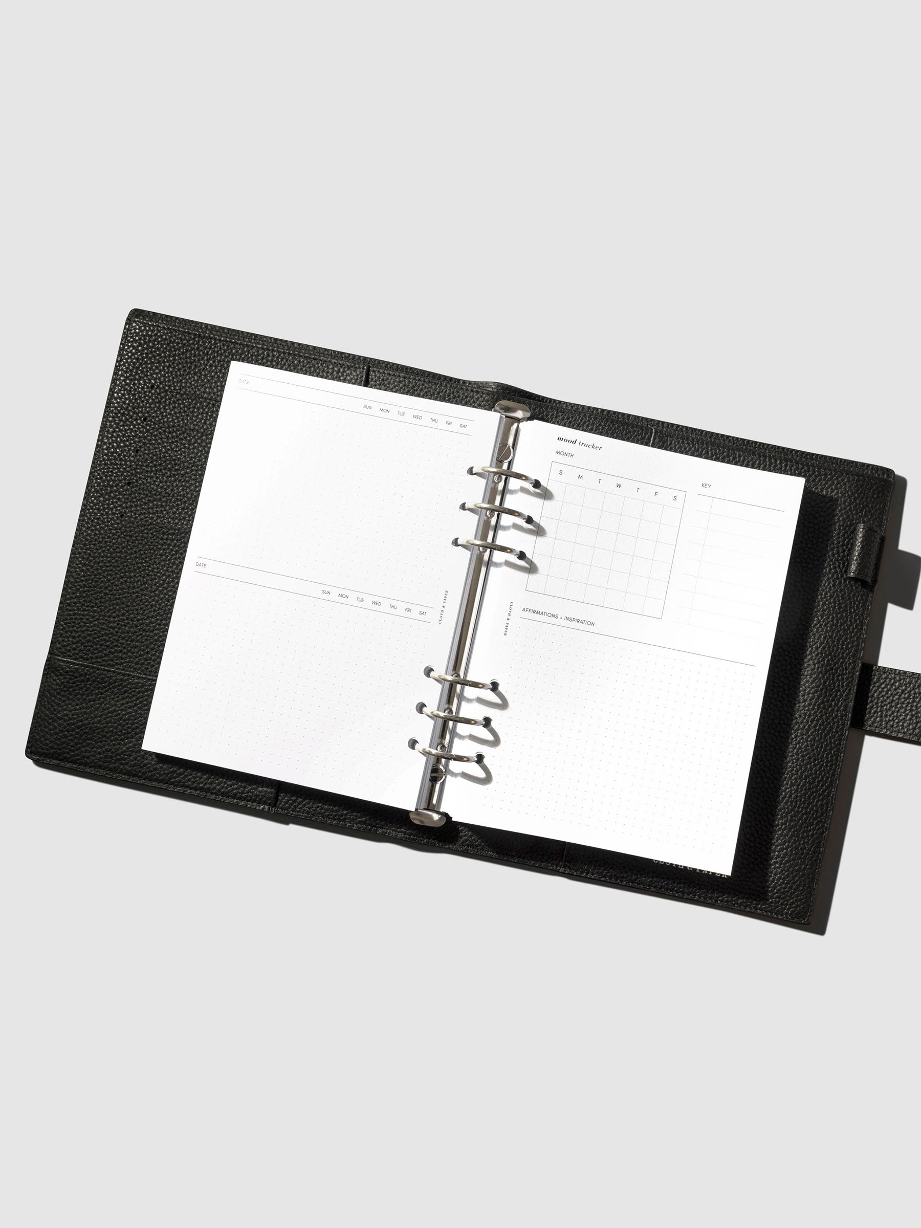 Inserts in use inside a leather planner.