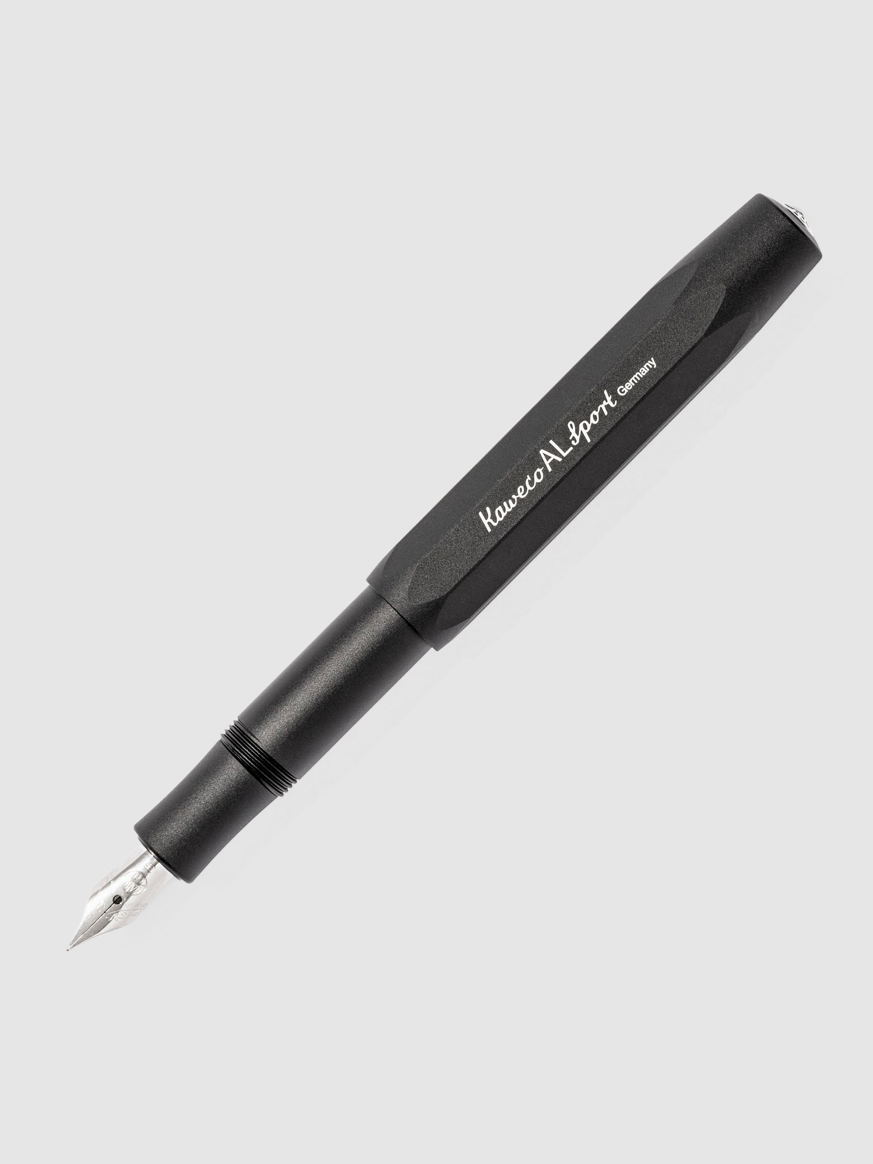 Black Kaweco pen displayed on a neutral background. The pen's nib is exposed.