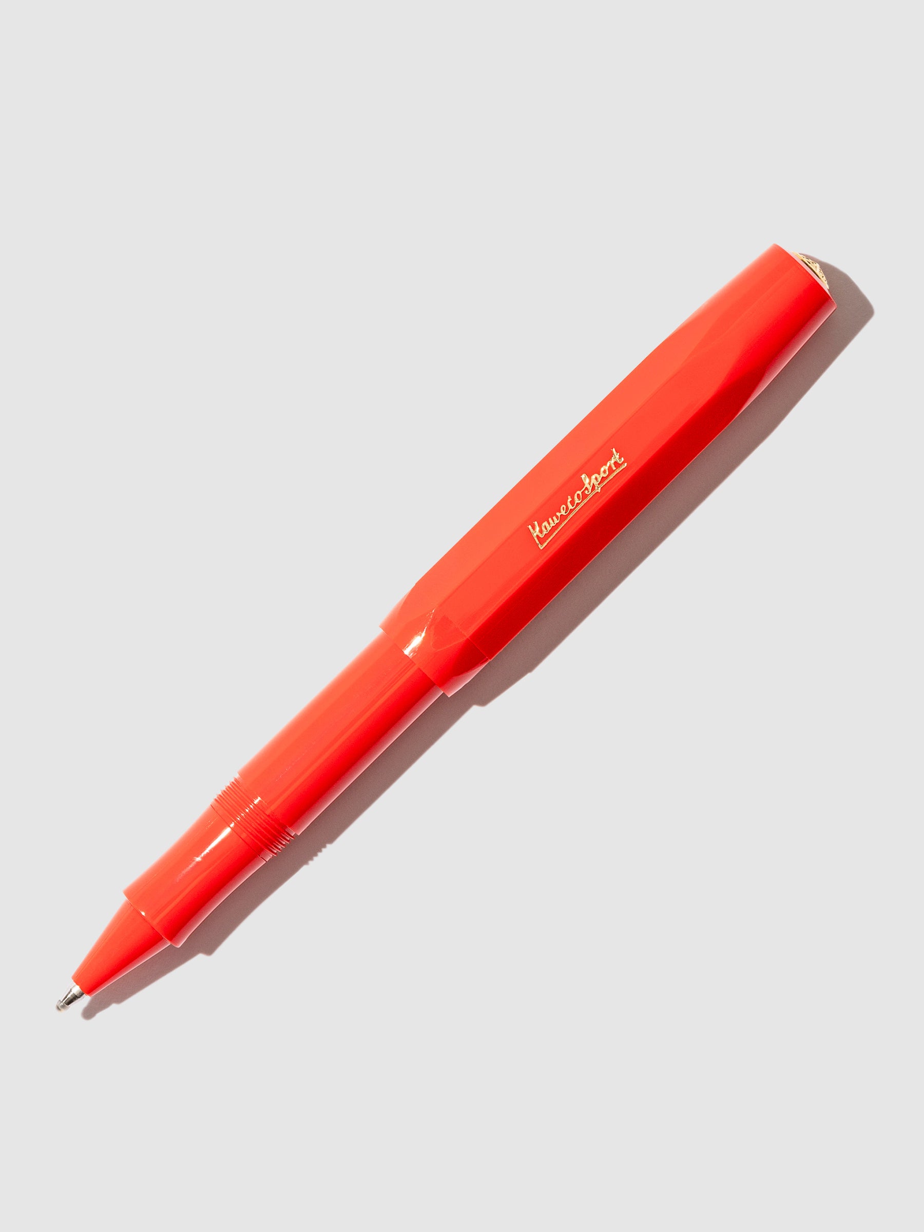 Kaweco Classic Sport Rollerball Pen, Red, Cloth and Paper. Pen displayed on a neutral background. The pen's nib is exposed.