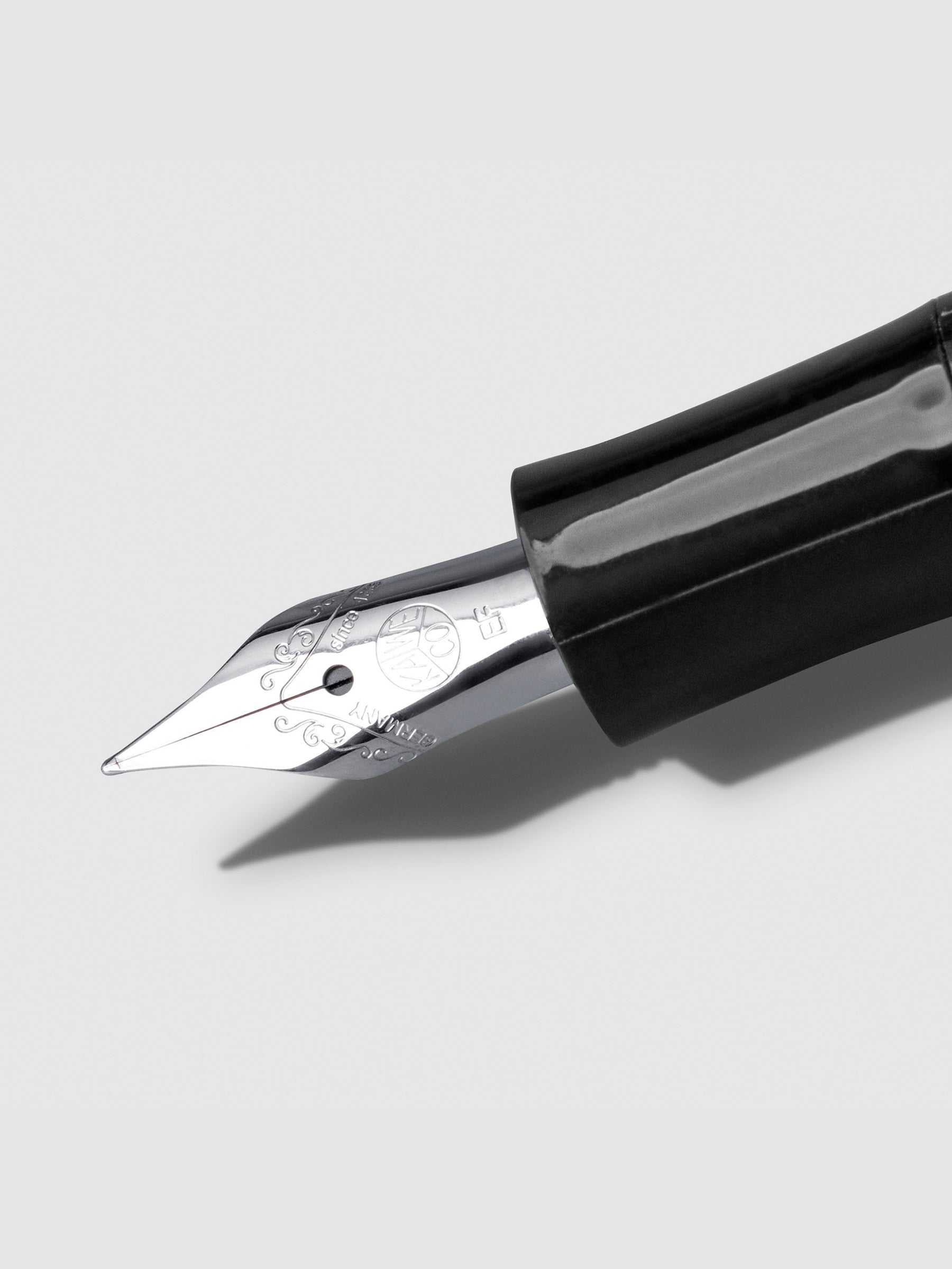 Silver extra fine nib displayed on a neutral background.