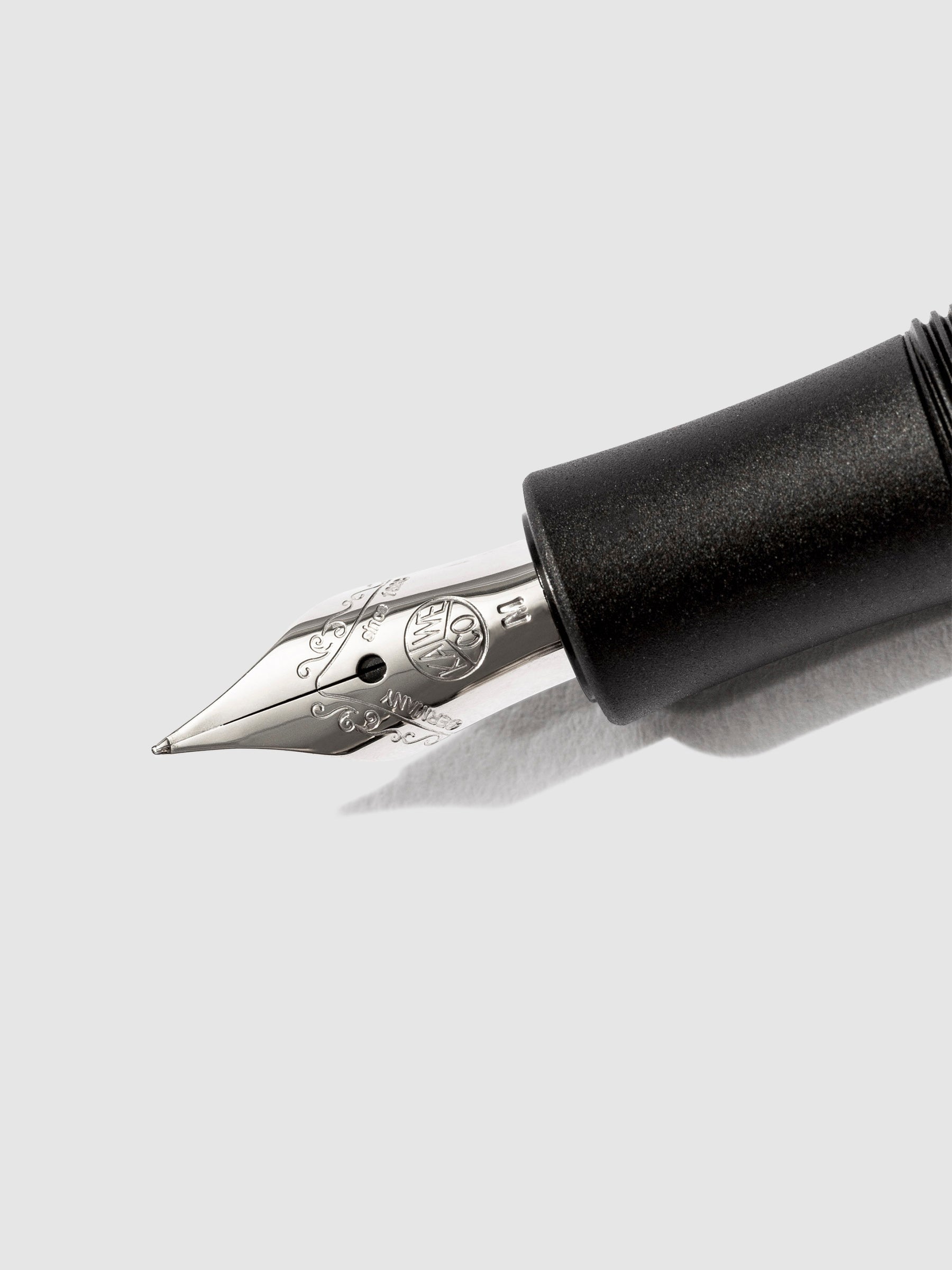 lose up image of pen nib on a white background.