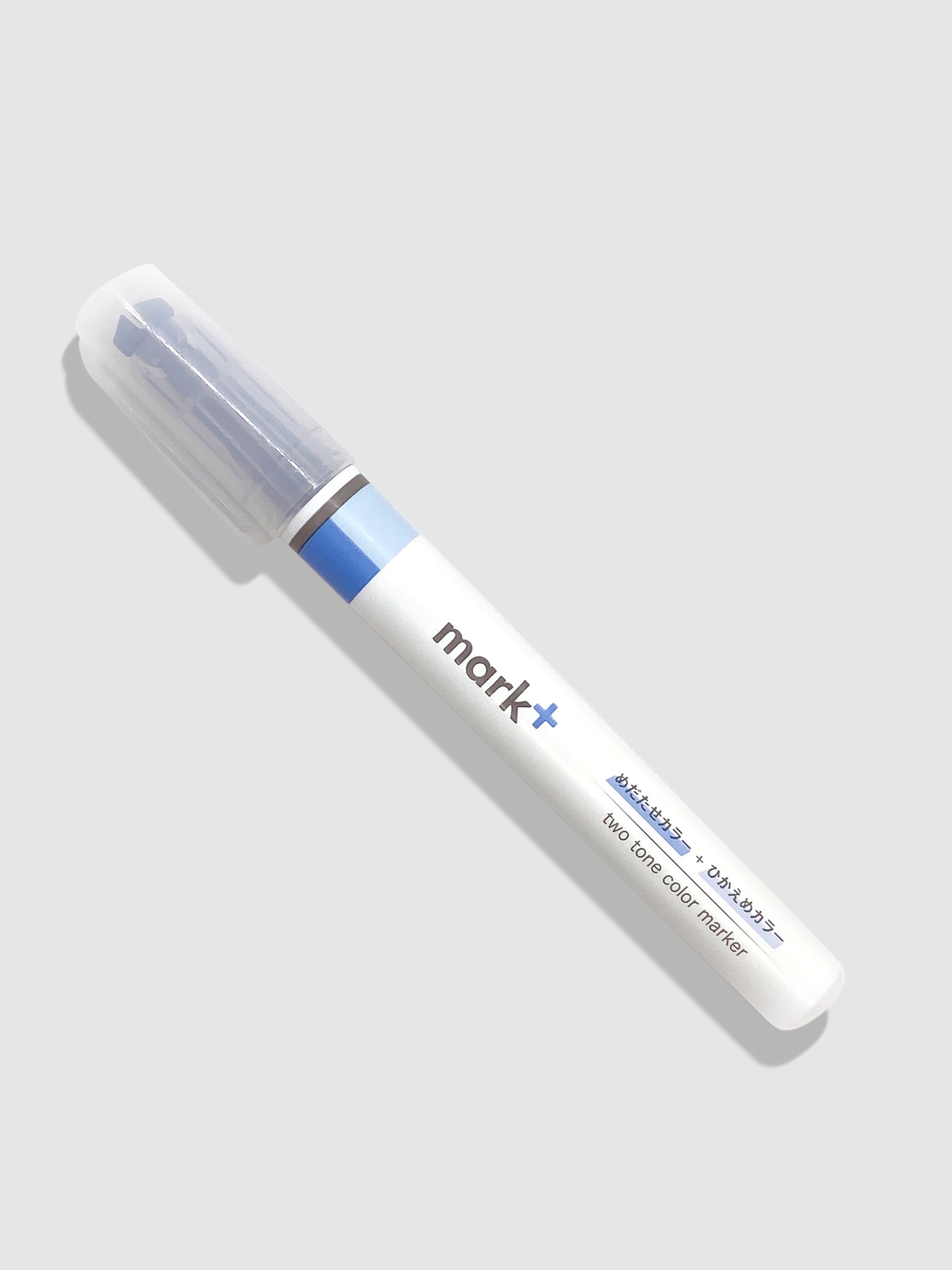 Kokuyo Mark Plus Two Tone Highlighter in Blue turned to the left against a neutral background.