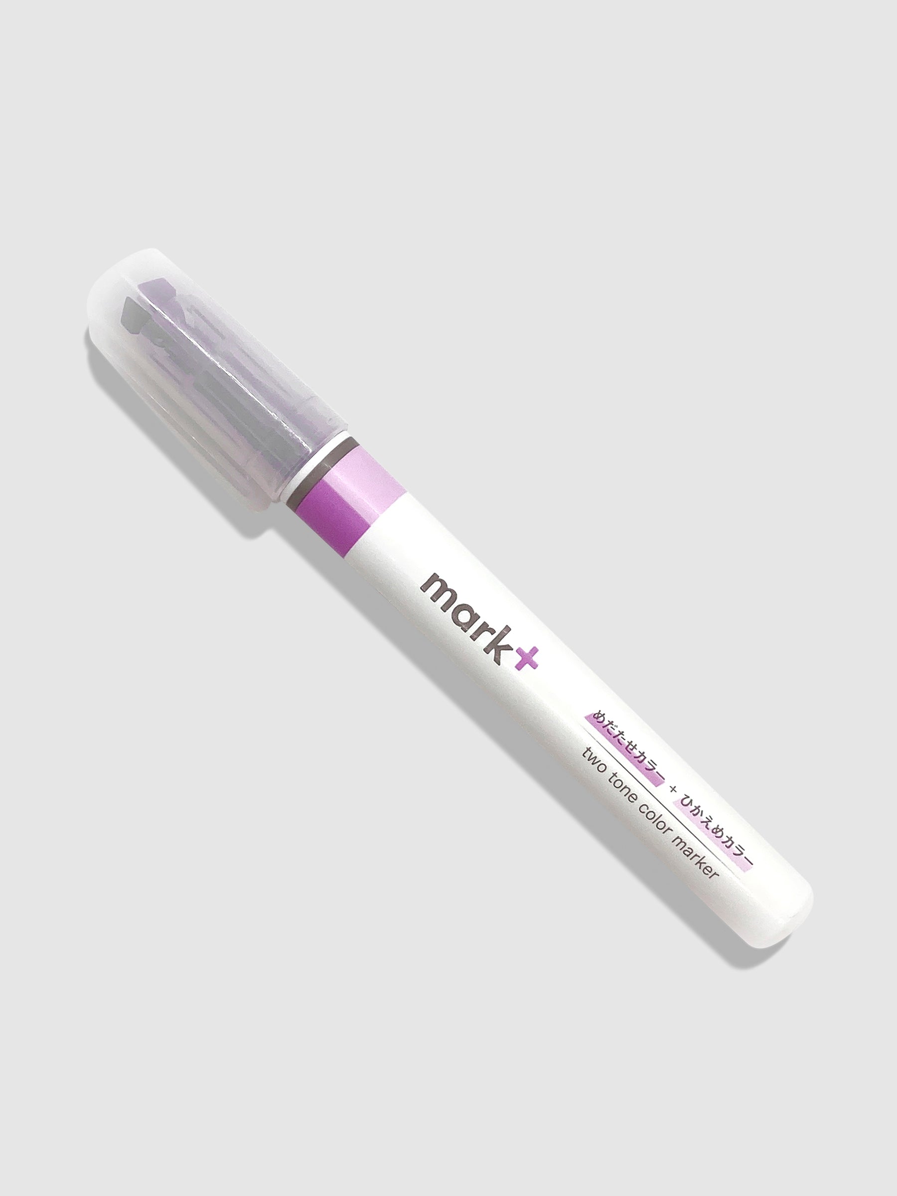 Kokuyo Mark Plus Two Tone Highlighter in Purple turned to the left against a neutral background.