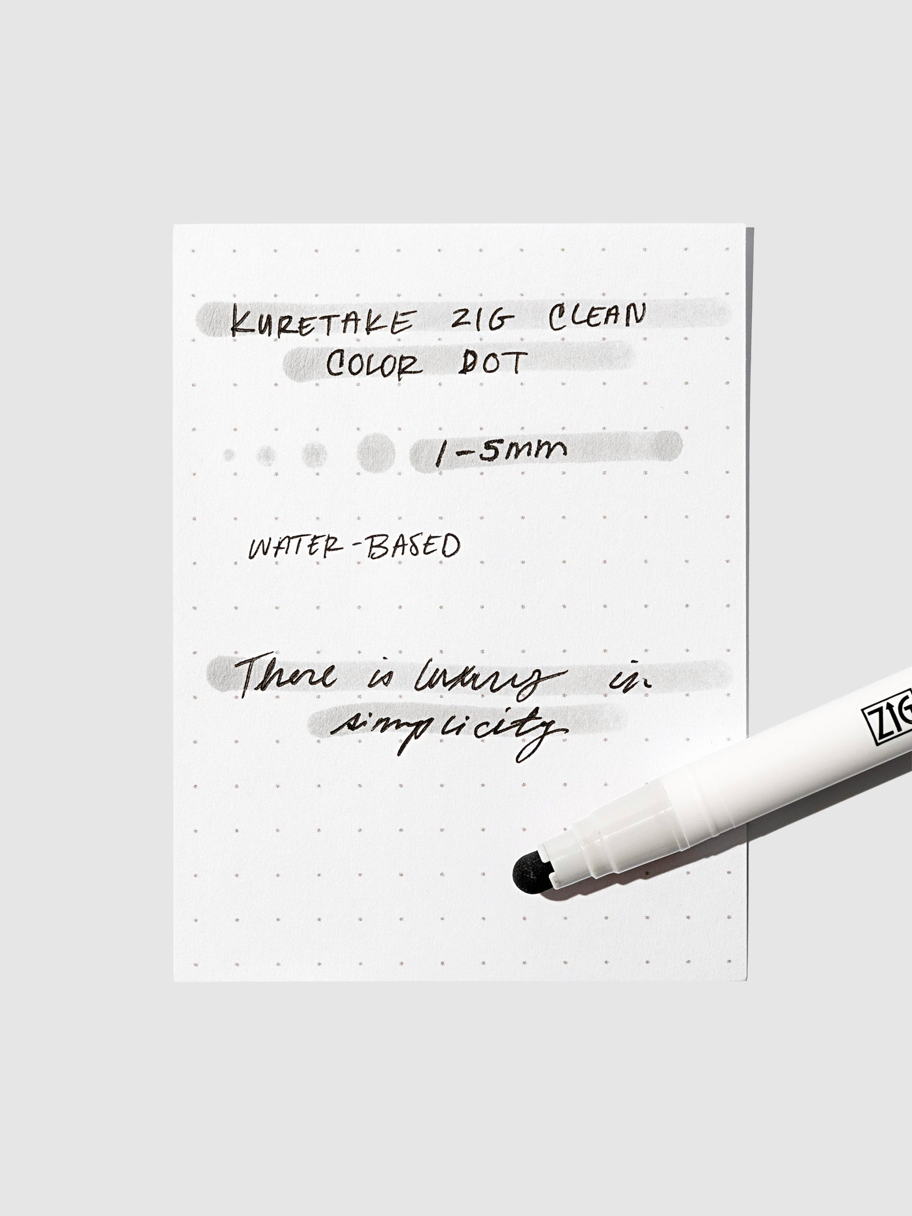 Dot marker displayed on top of an in use pen testing sheet. Color shown is Light Platinum.