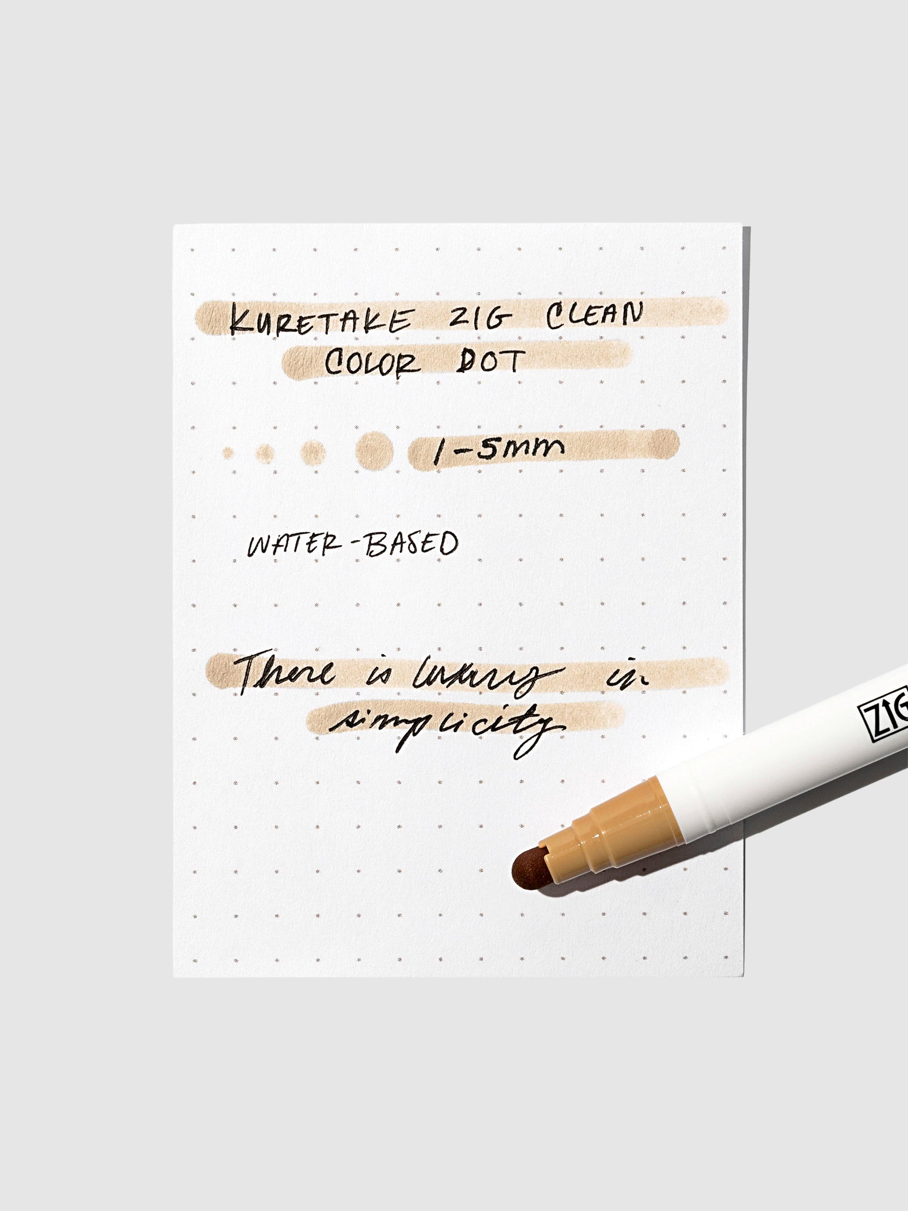 Dot marker displayed on top of an in use pen testing sheet. Color shown is Oatmeal.
