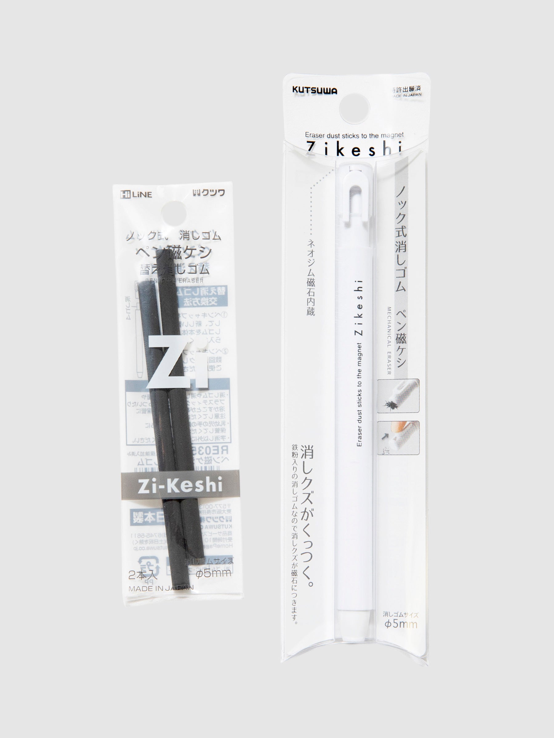Kutsuwa Zikeshi Eraser, White, Cloth and Paper. Black eraser refills and the white eraser body that are meant to fill in their packaging. They are against a neutral background.