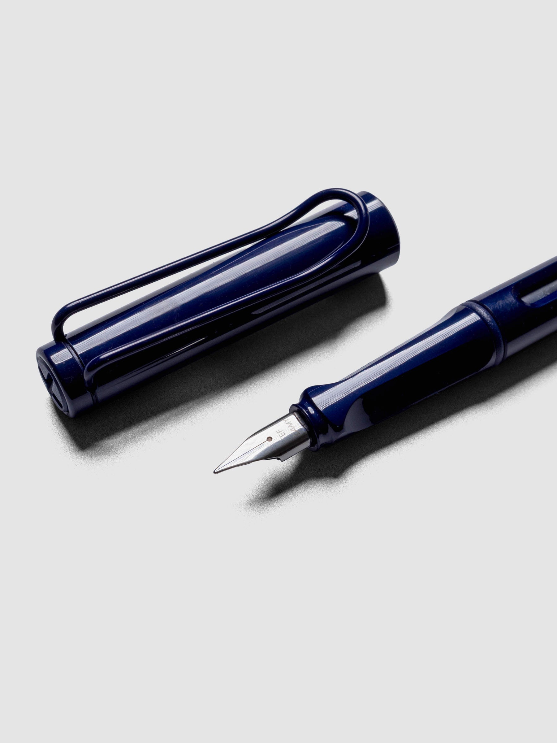 Close up view of the LAMY Safari Fountain Pen in the color Dark Dusk with Extra Fine nib shown diagonally with the cap off.