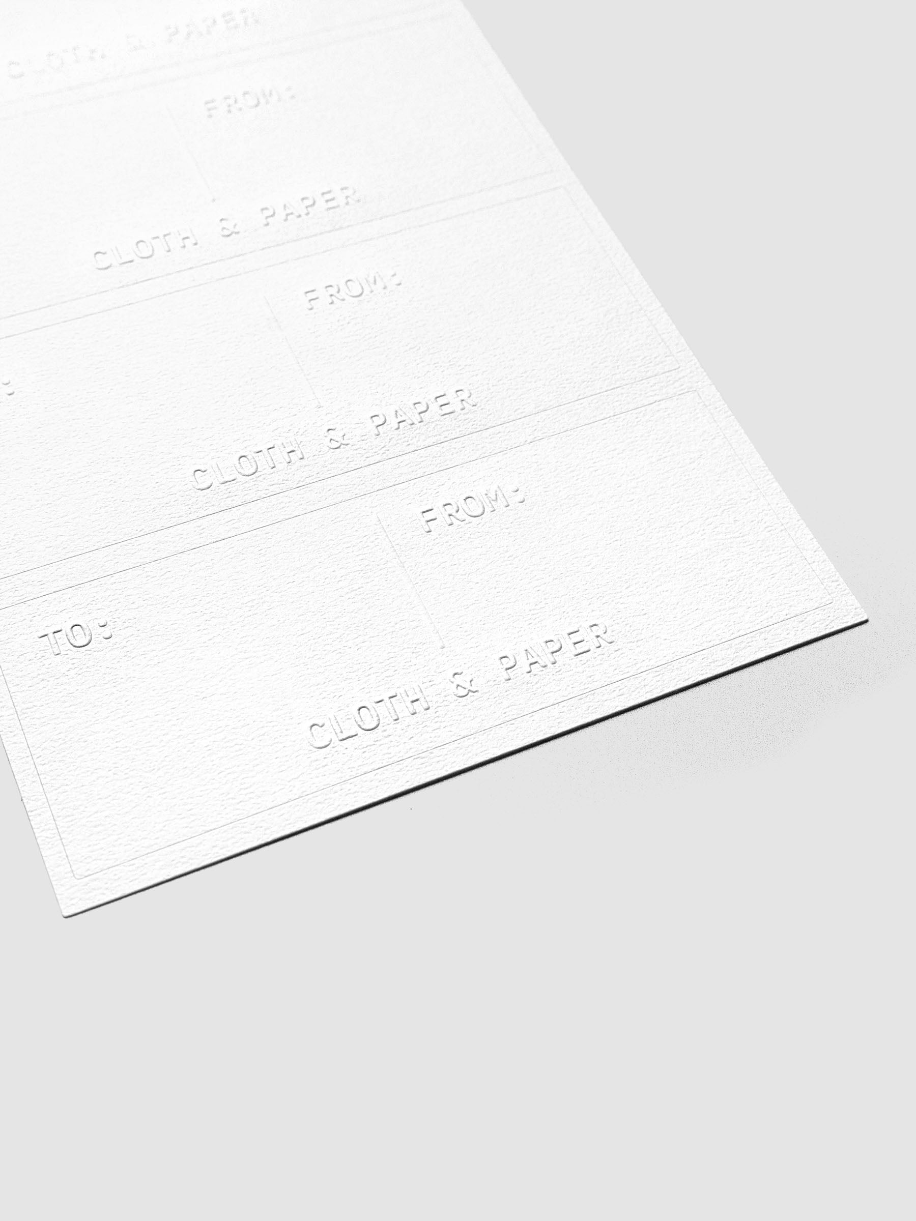 Close up of a sticker sheet of Label Planner Stickers | Gift Tag on a neutral background.