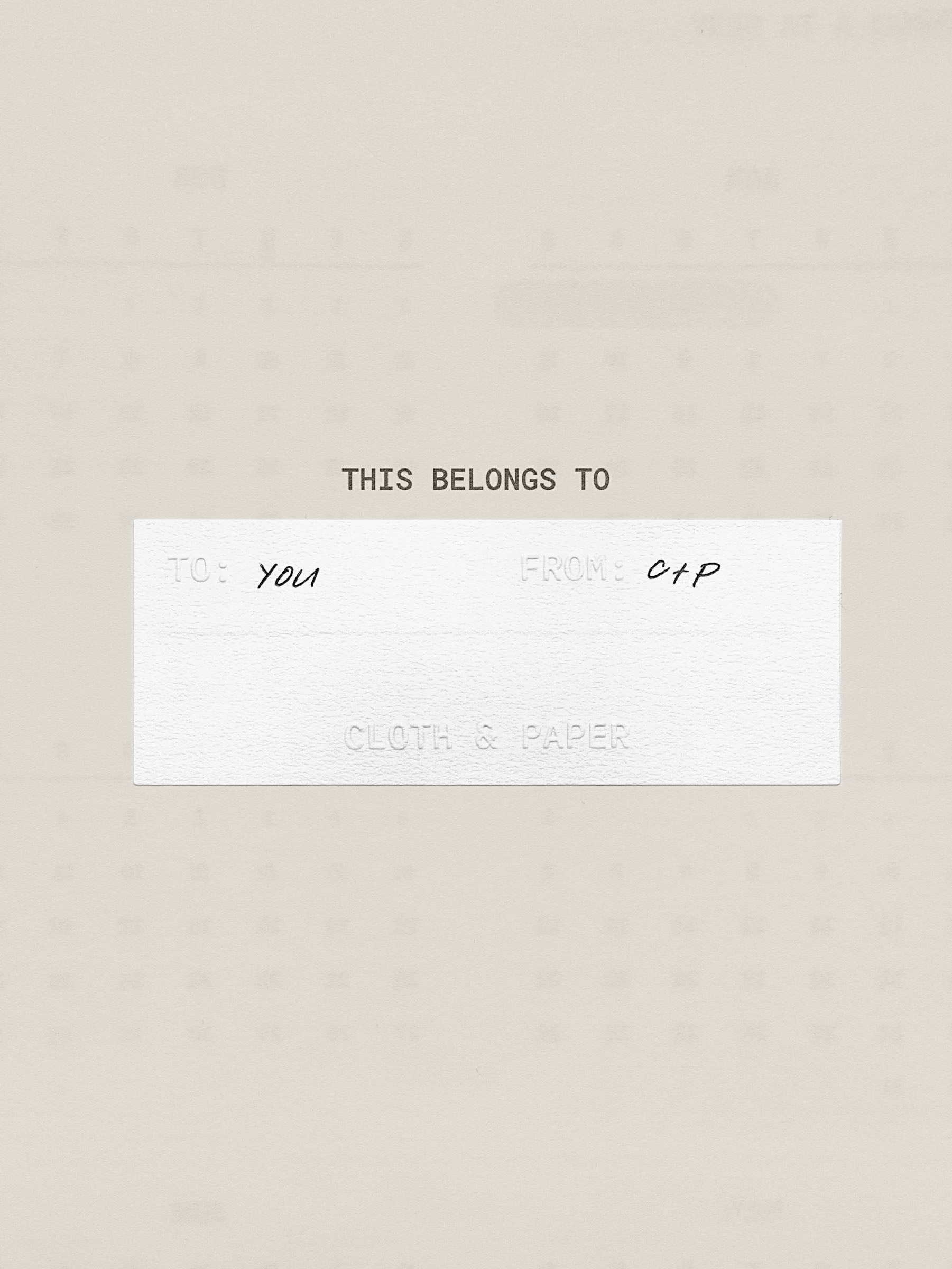 Close up of one Label Planner Stickers | Gift Tag on a beige background with handwritten text.