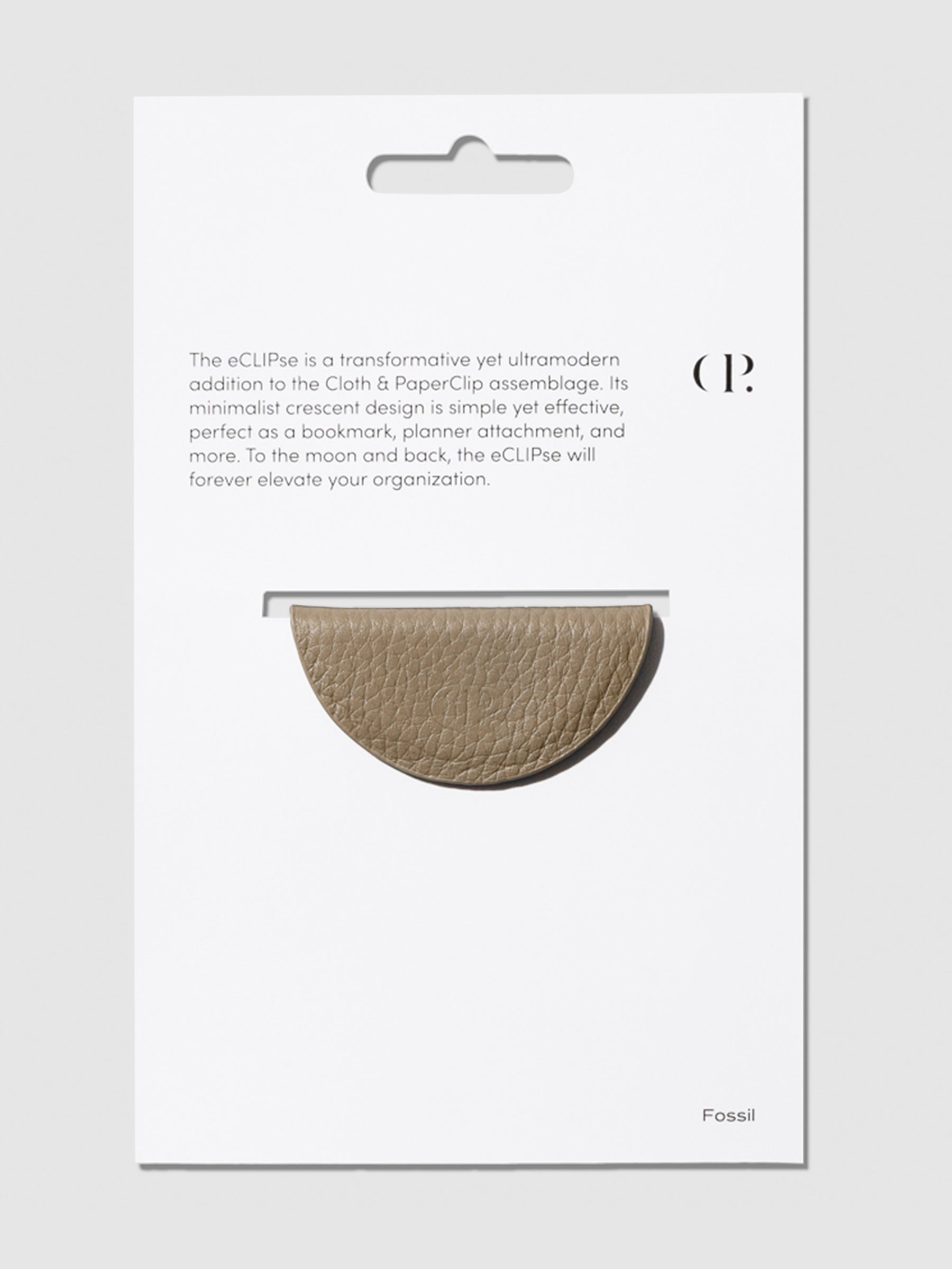 Brown bookmark shown in its packaging on a neutral background.