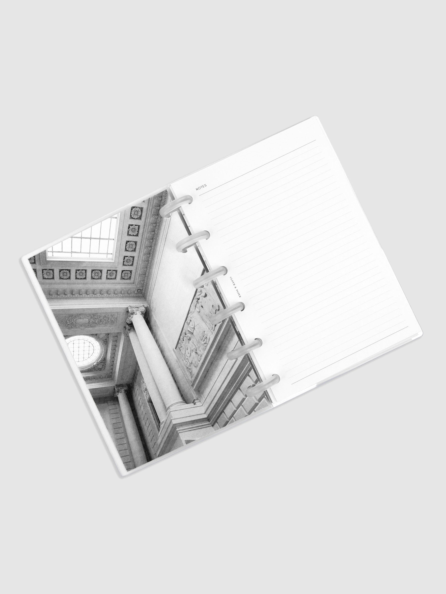 CP Petite size discbound planner with a black and white dashboard on the left and a lined notes planner insert on the right.