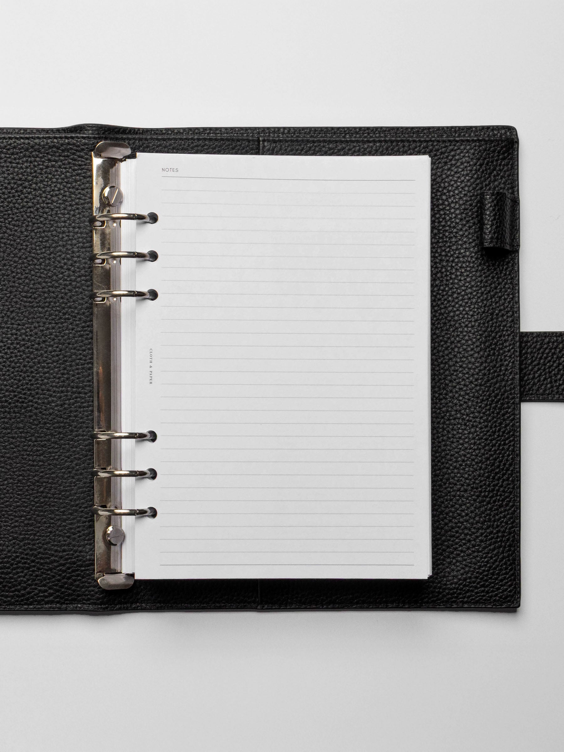 Insert in use inside a black leather planner.