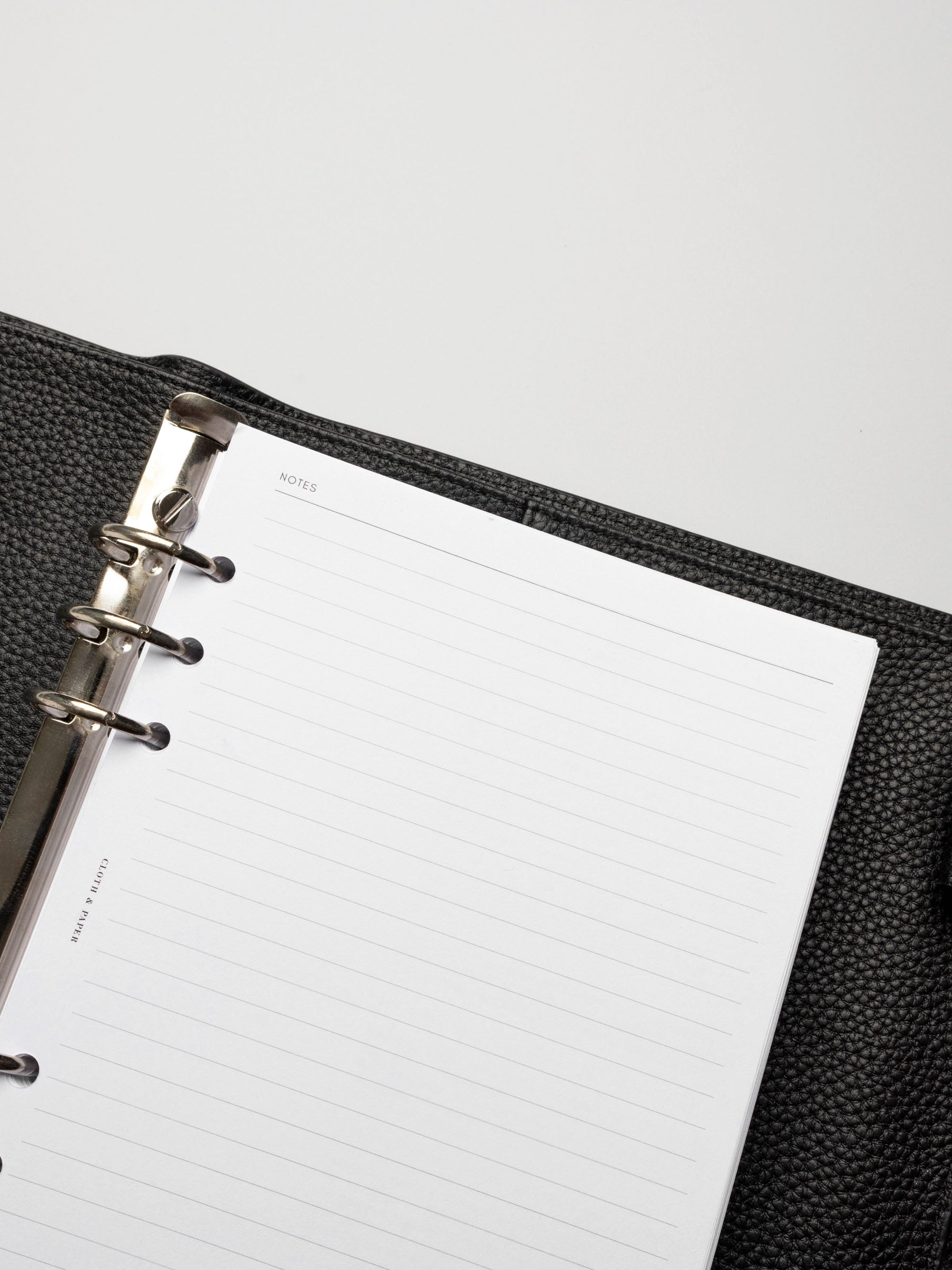 Insert in use inside a black leather planner.