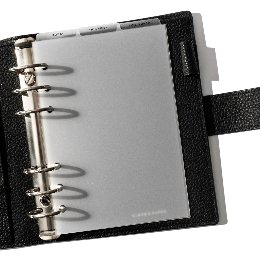 Personal Wide Black Foil Cadence Tab Dividers displayed in a black leather planner.