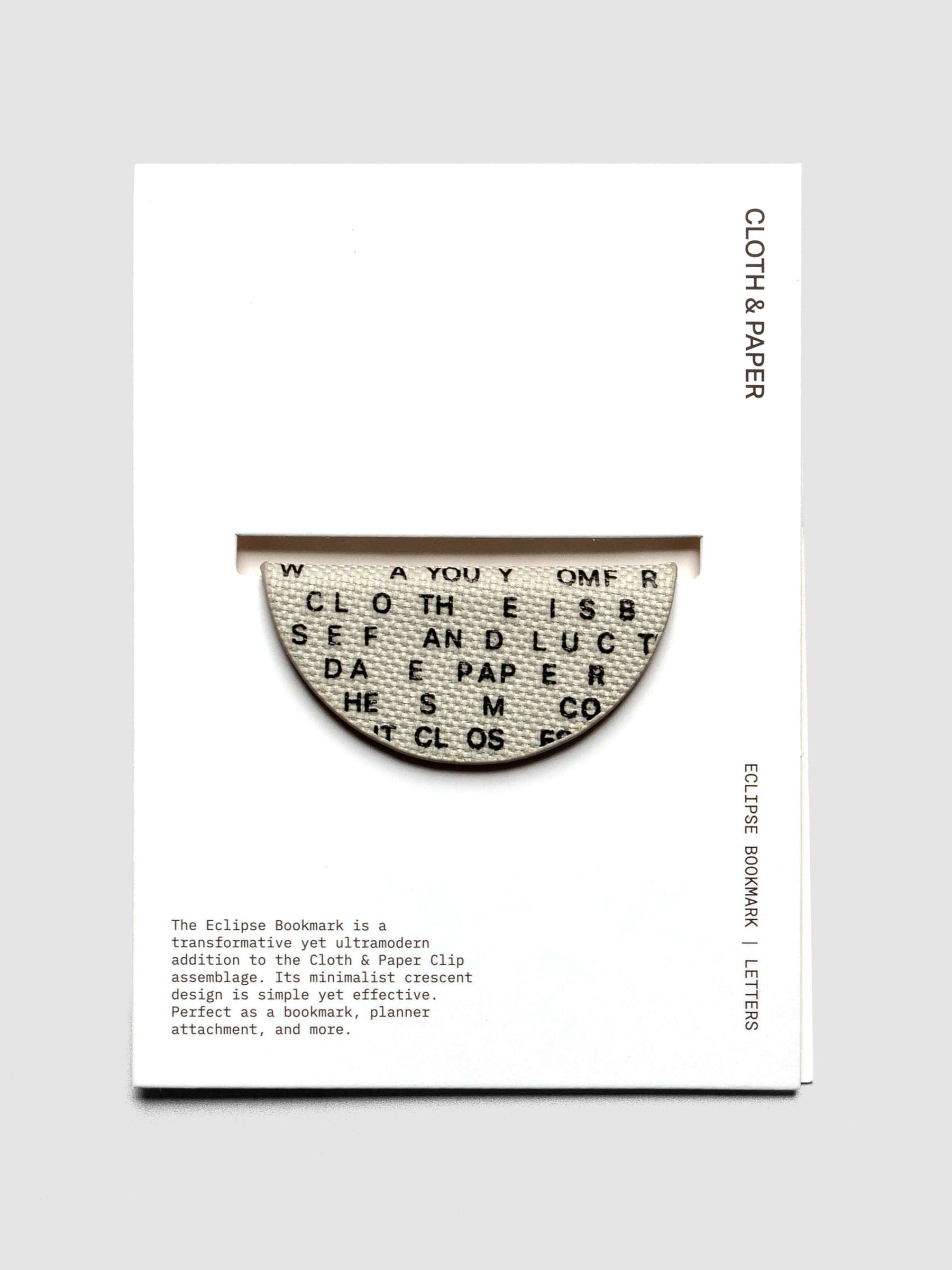 Magnetic Bookmark | Bookcloth | Letters shown in packaging on a neutral background.