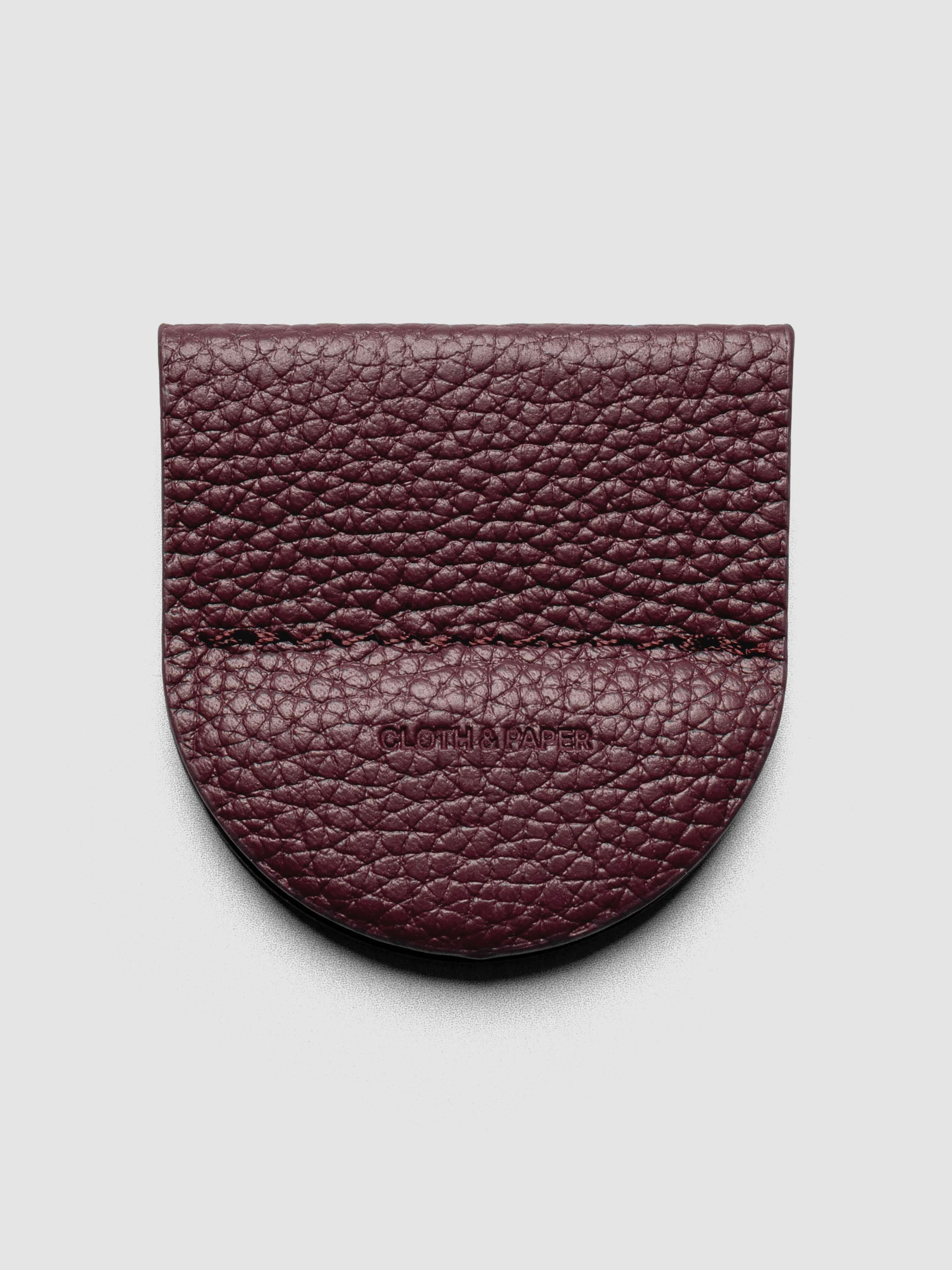 Image shows the Magnetic Bookmark | Pen Holder in Bordeaux, a deep red, displayed on a neutral background.