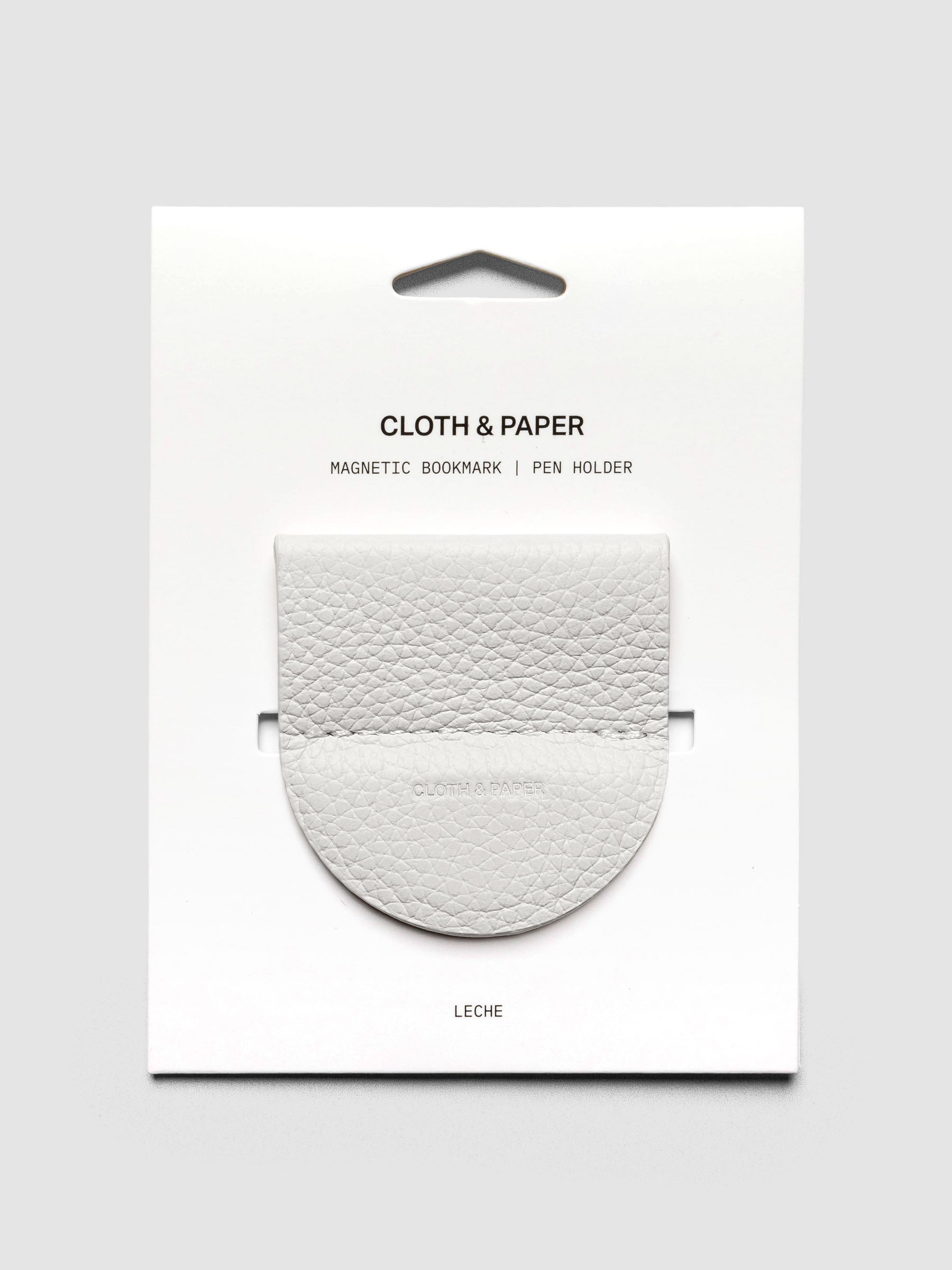 Magnetic Bookmark | Pen Holder in color Leche (white) shown in packaging.