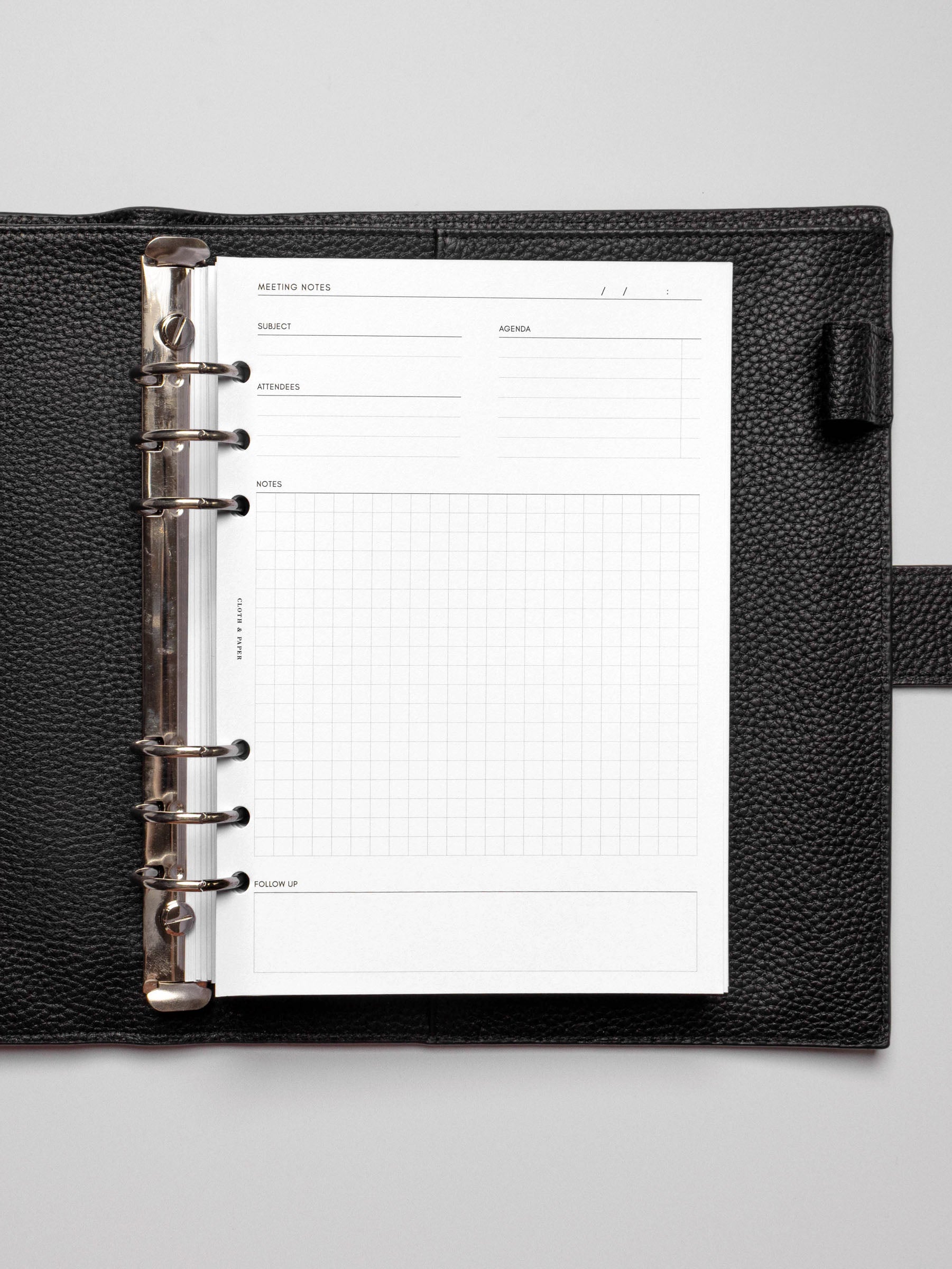 Insert in use inside a black leather planner.