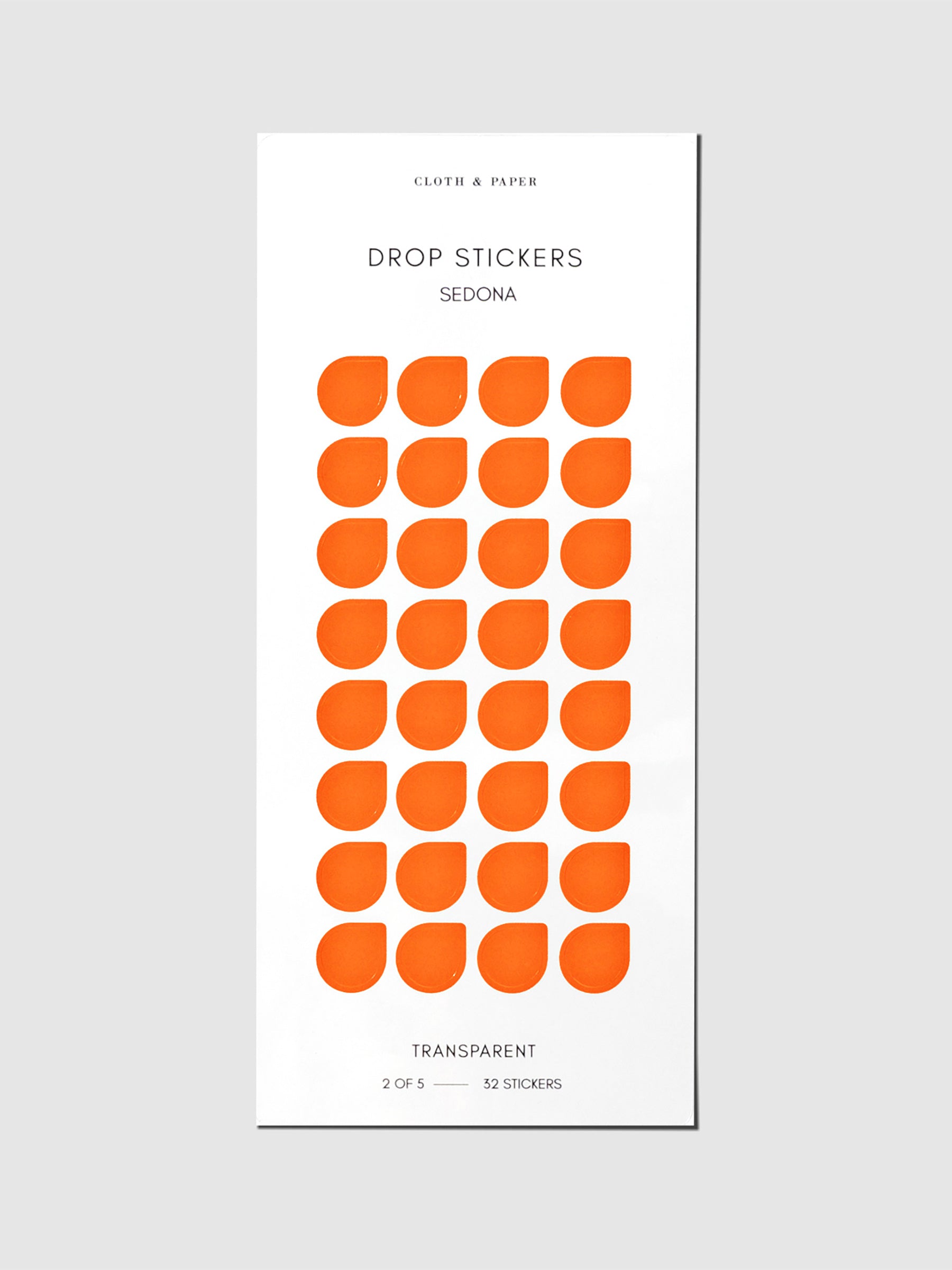 Minimal Shape Sticker Set, Transparent Drops, Sedona, Cloth and Paper. Drop stickers in their packaging on a gray background.