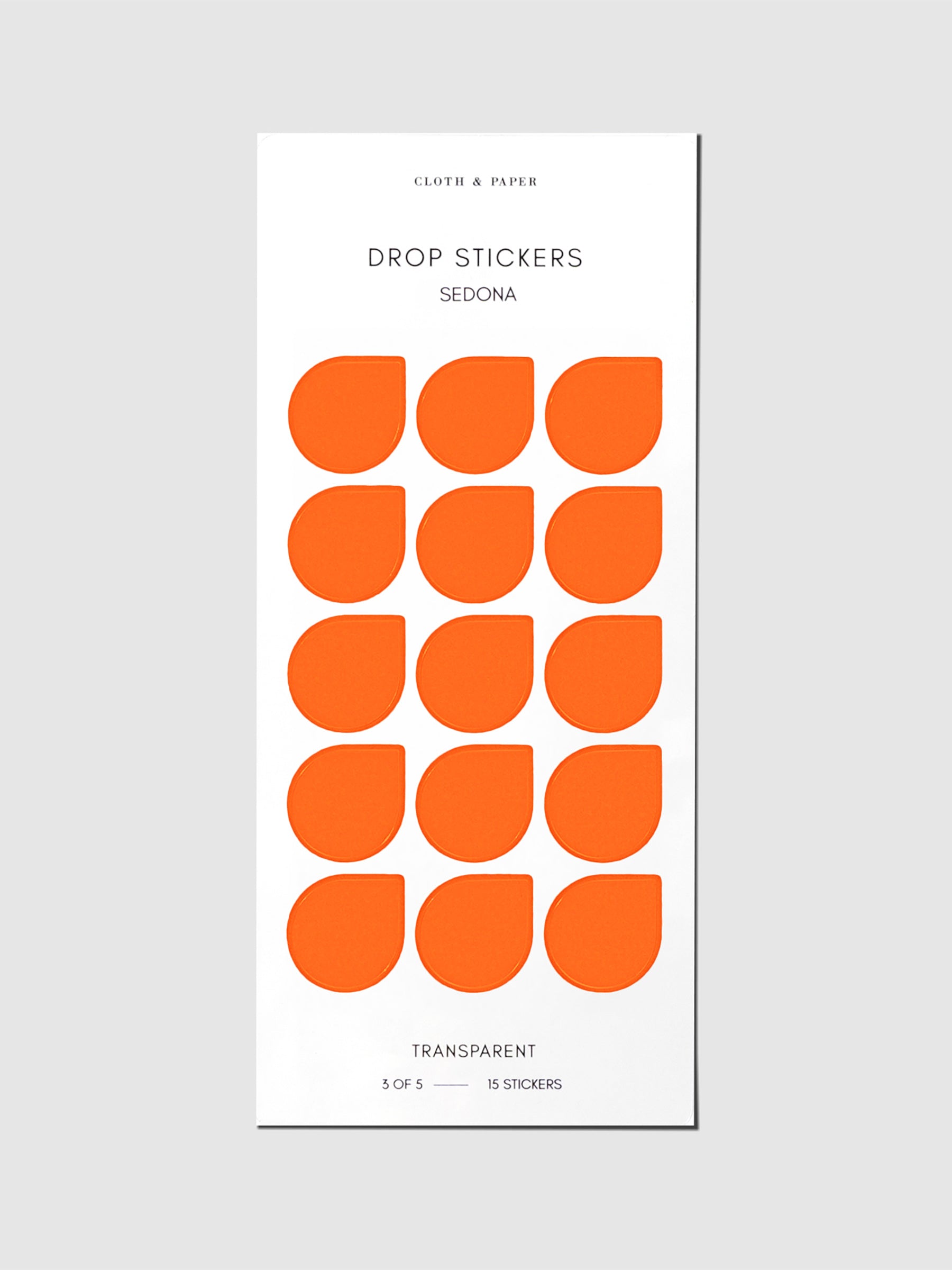 Minimal Shape Sticker Set, Transparent Drops, Sedona, Cloth and Paper. Drop stickers in their packaging on a gray background.