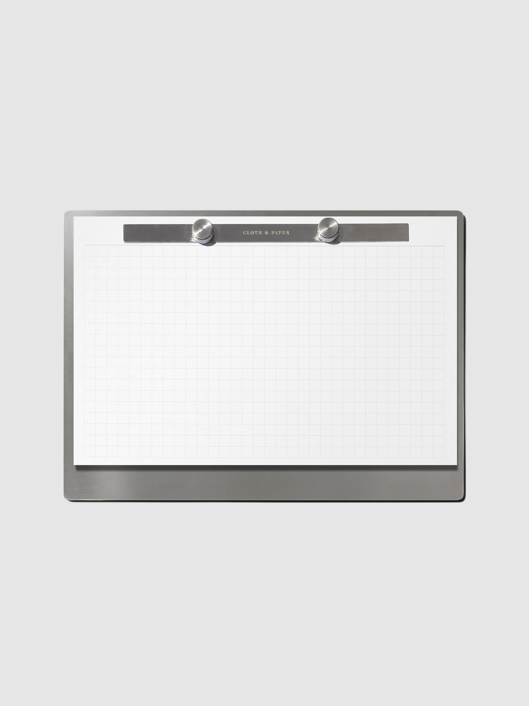 Modern Bound Notepad Insert Refills, graph, filled on the Modern Bound Notepad board, resting on a neutral background