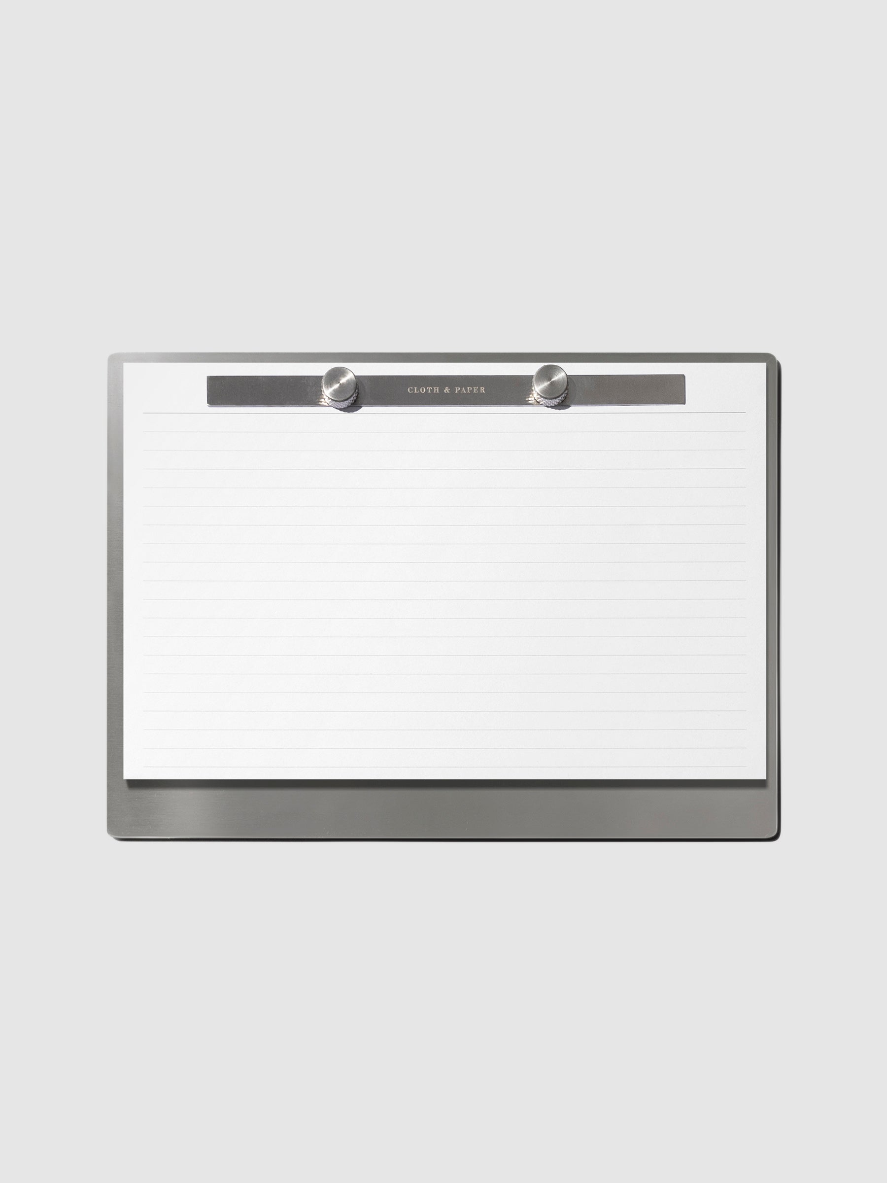 Modern Bound Notepad Insert Refills, lined, filled on the Modern Bound Notepad board, resting on a light neutral background