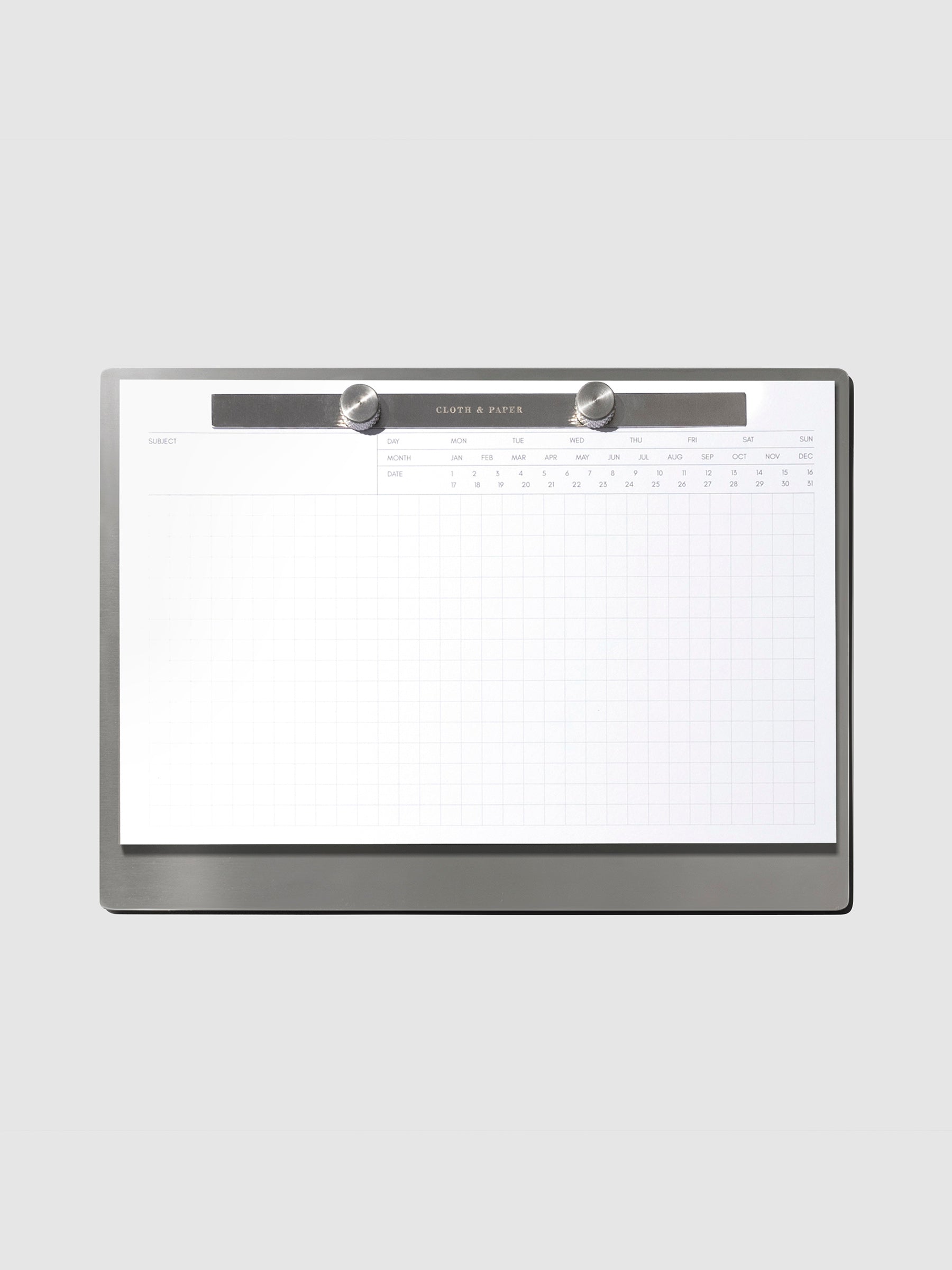 Modern Bound Notepad Insert Refills, executive notes, filled on the Modern Bound Notepad board, resting on a light gray background
