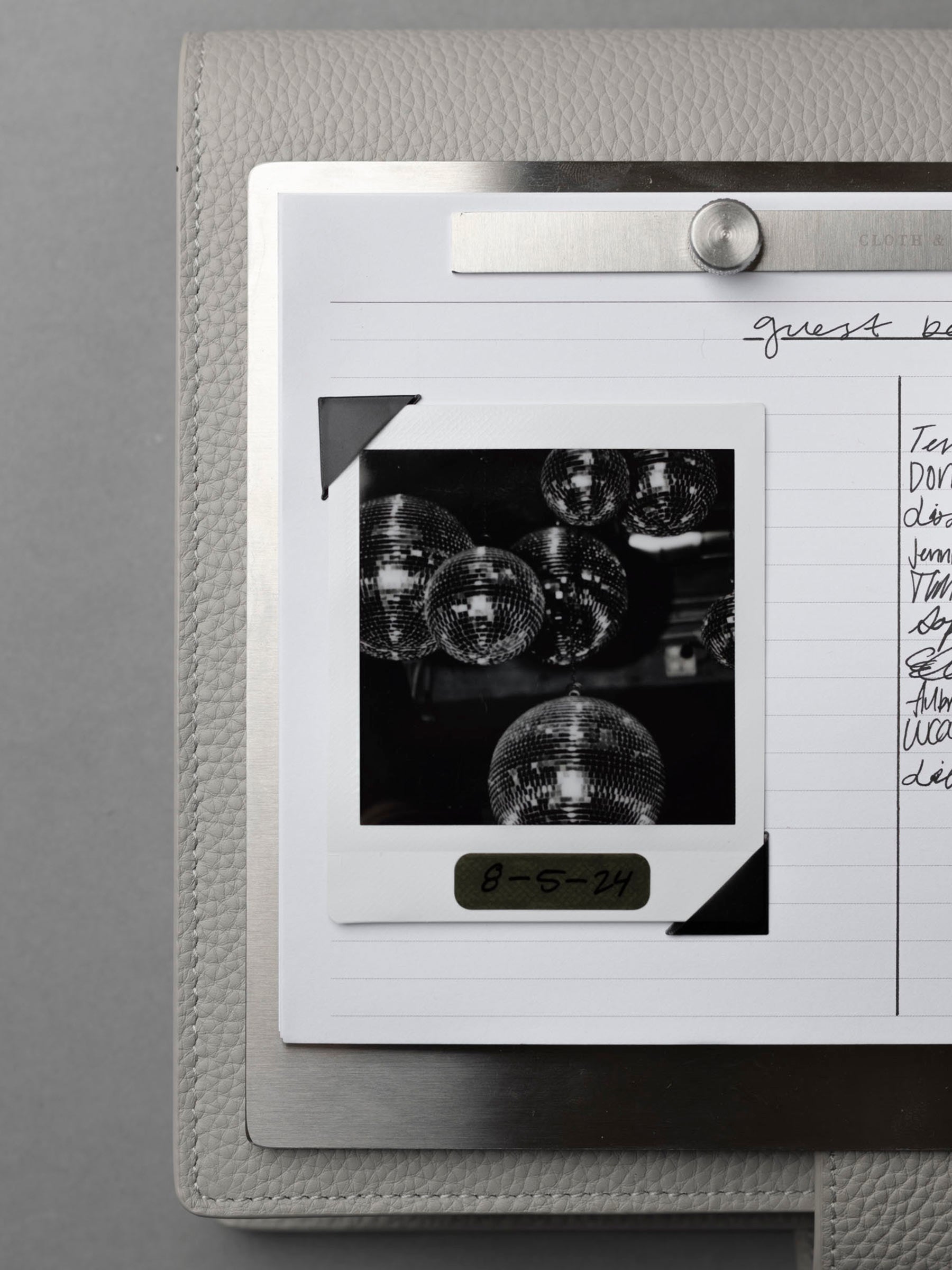 Modern Bound Notepad board, which is stainless steel metal with inserts.