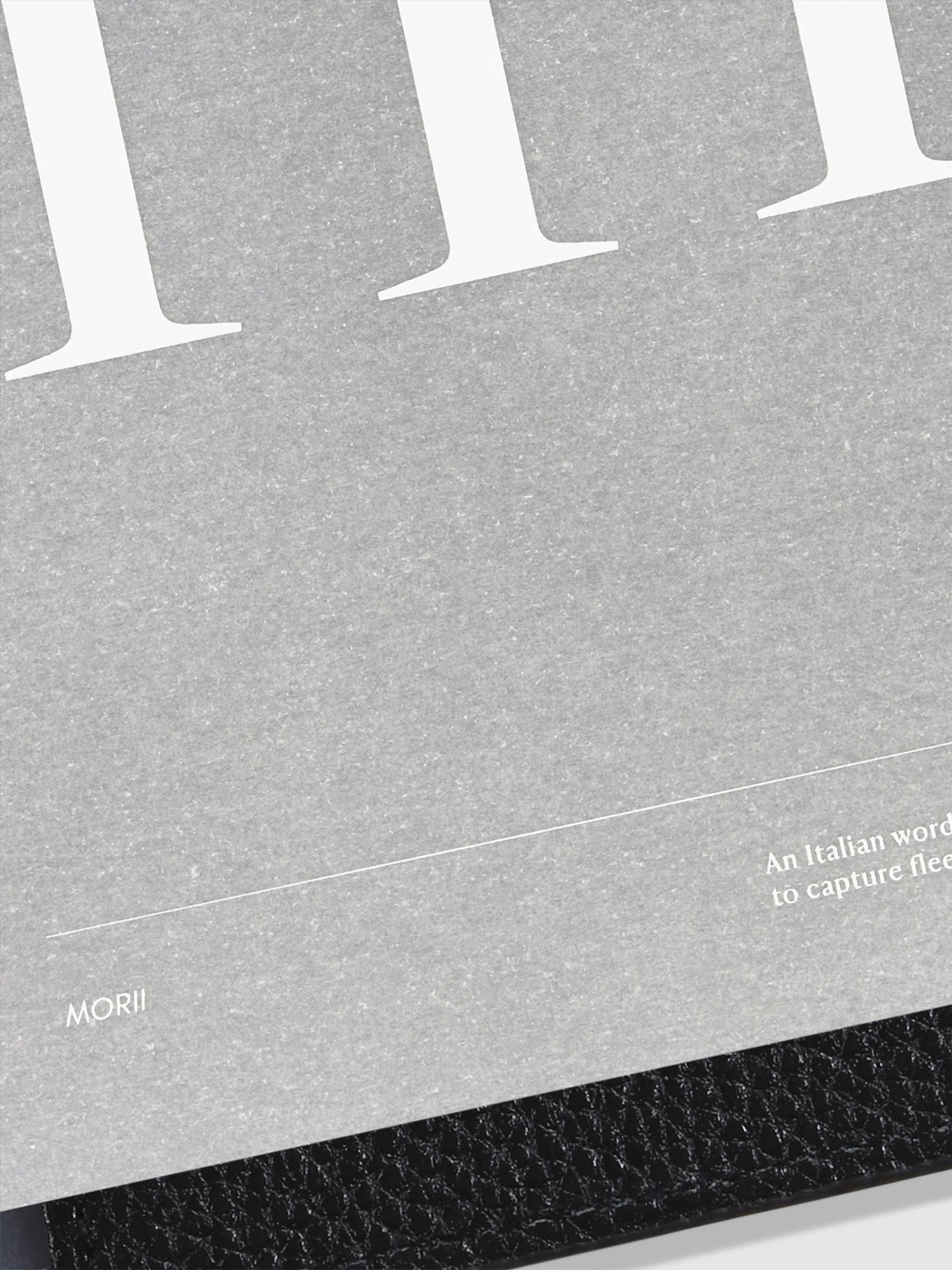 Monogram Vellum Planner Dashboard M in use in a leather planner.