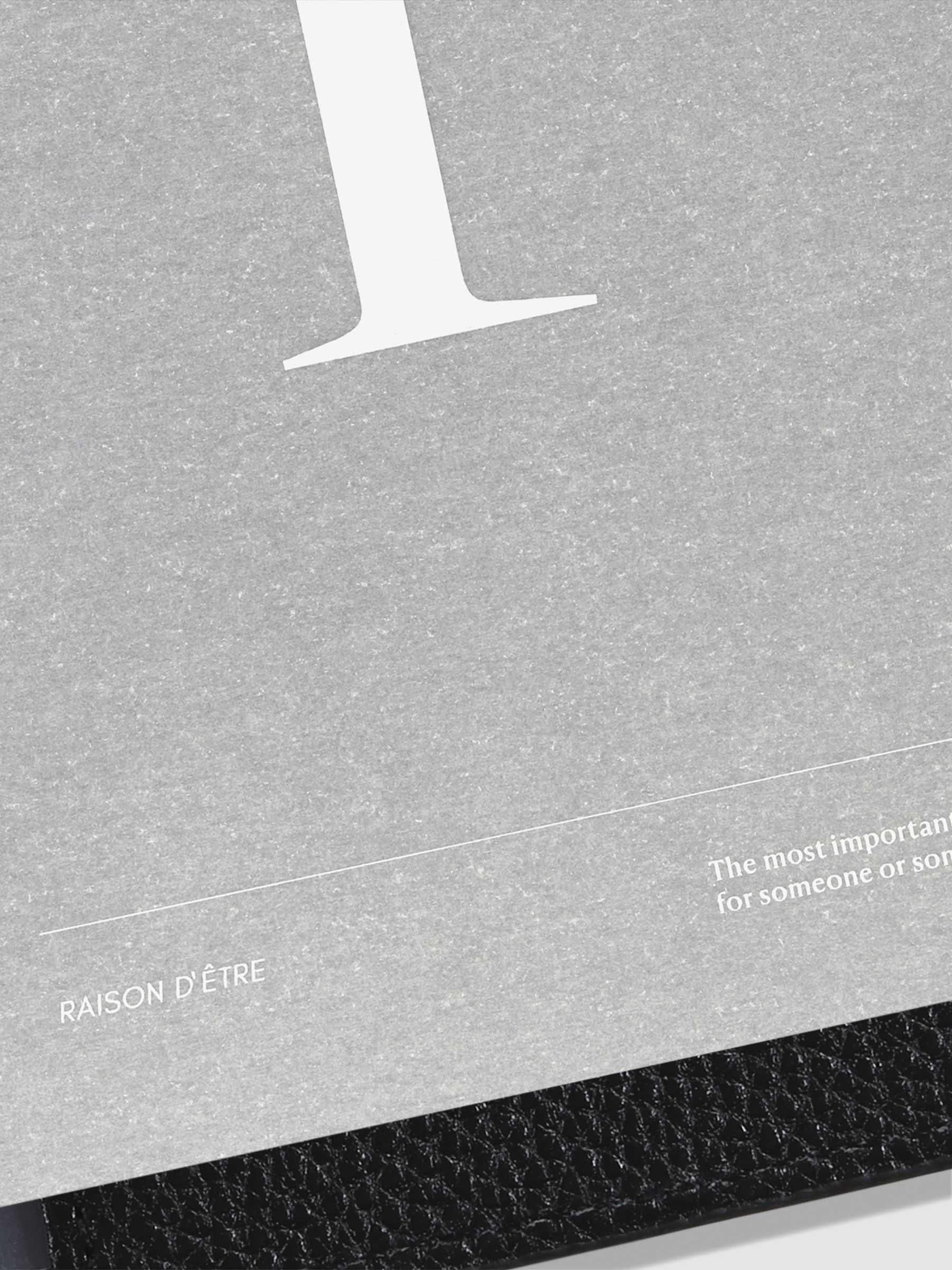 Monogram Vellum Planner Dashboard R in use in a leather planner.