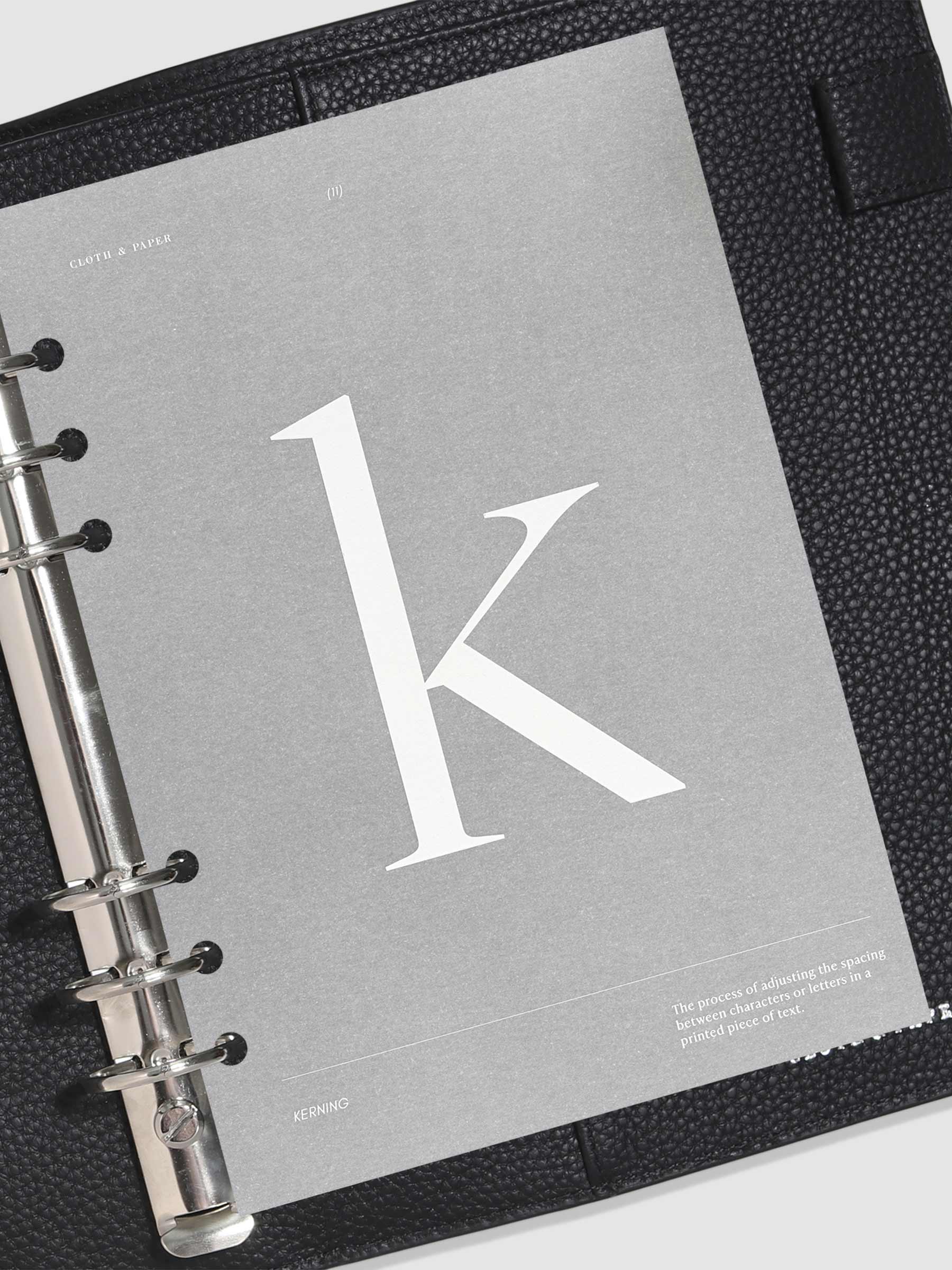 Monogram Vellum Planner Dashboard K in use in a leather planner.