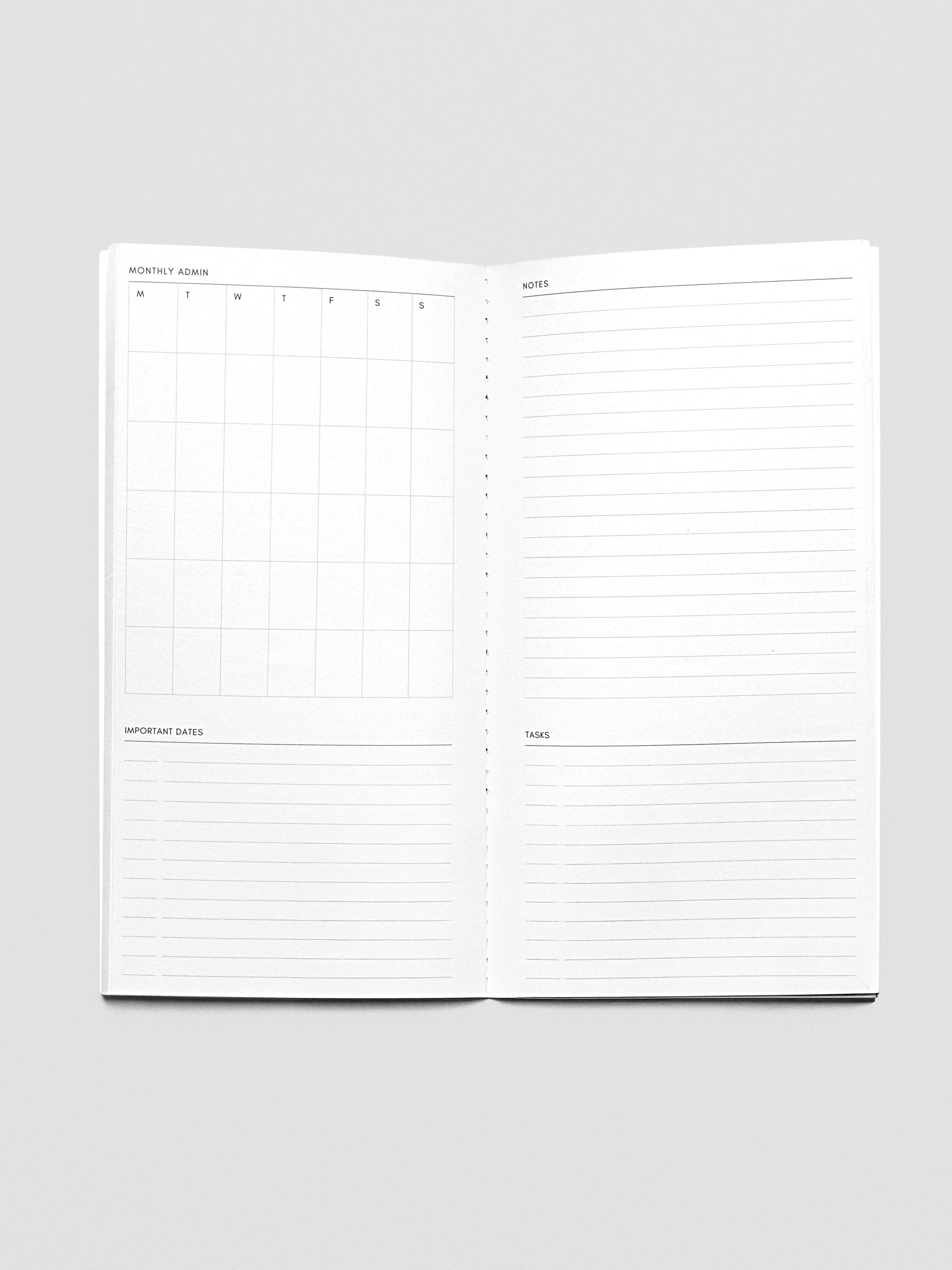 Travel Notebook in size A5 Slim in color Lagoon with Monthly Admin pages with inner pages shown.