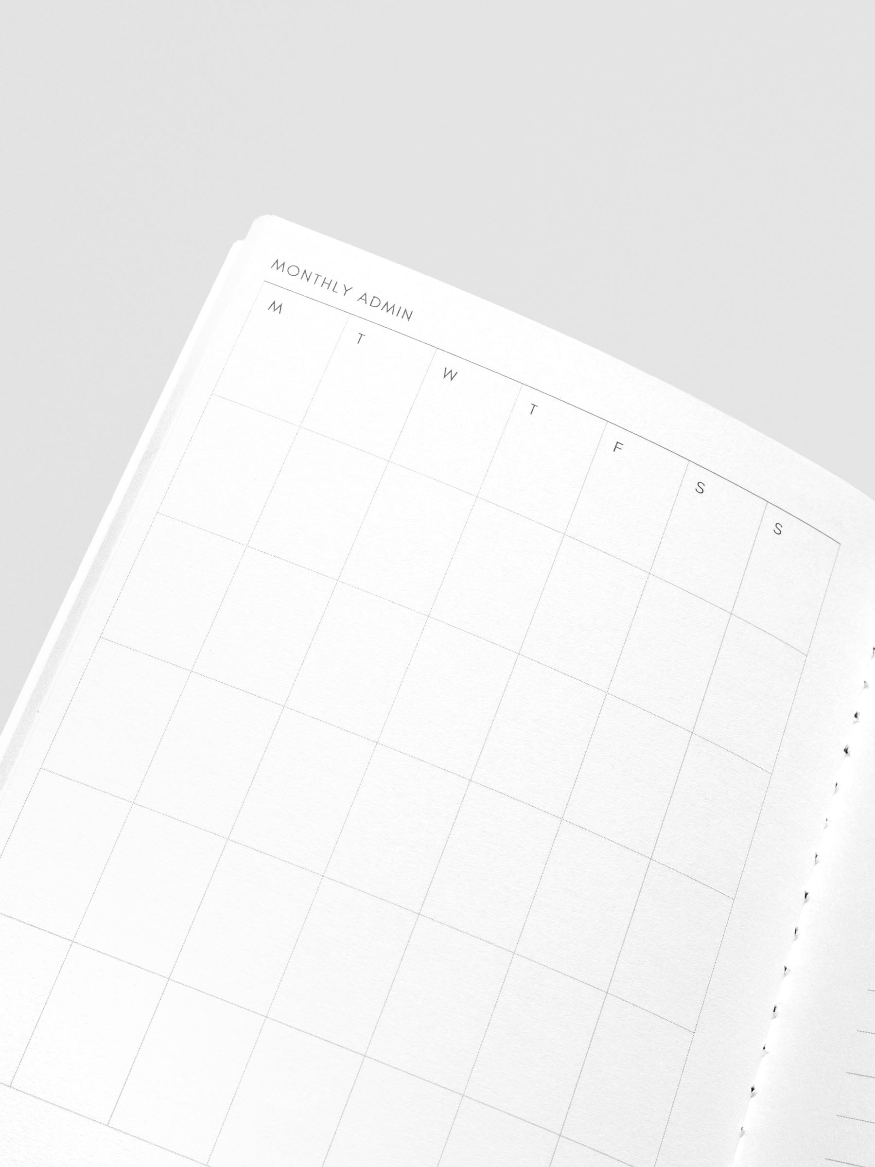 Travel Notebook in size A5 Slim in color Lagoon with Monthly Admin pages with inner pages shown in close up.