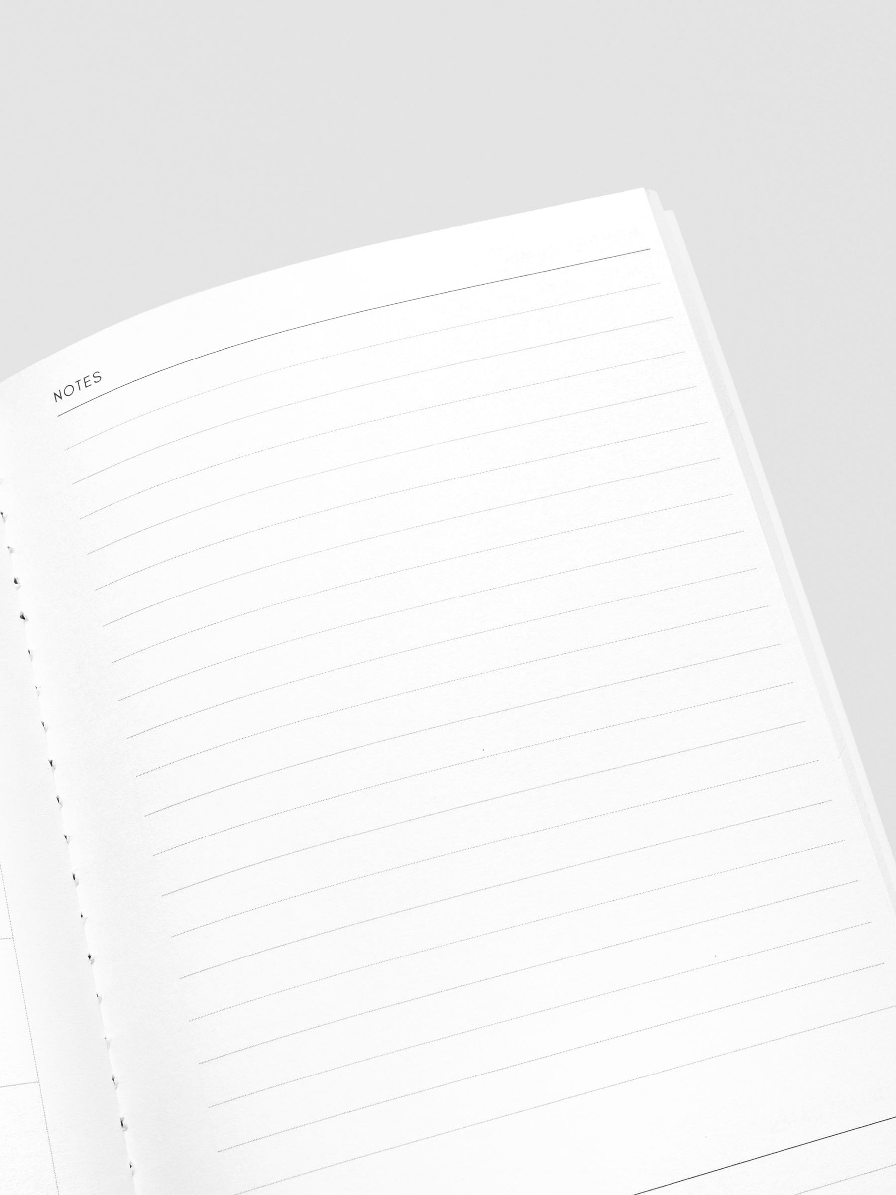 Travel Notebook in size A5 Slim in color Lagoon with Monthly Admin pages with inner pages shown in close up.