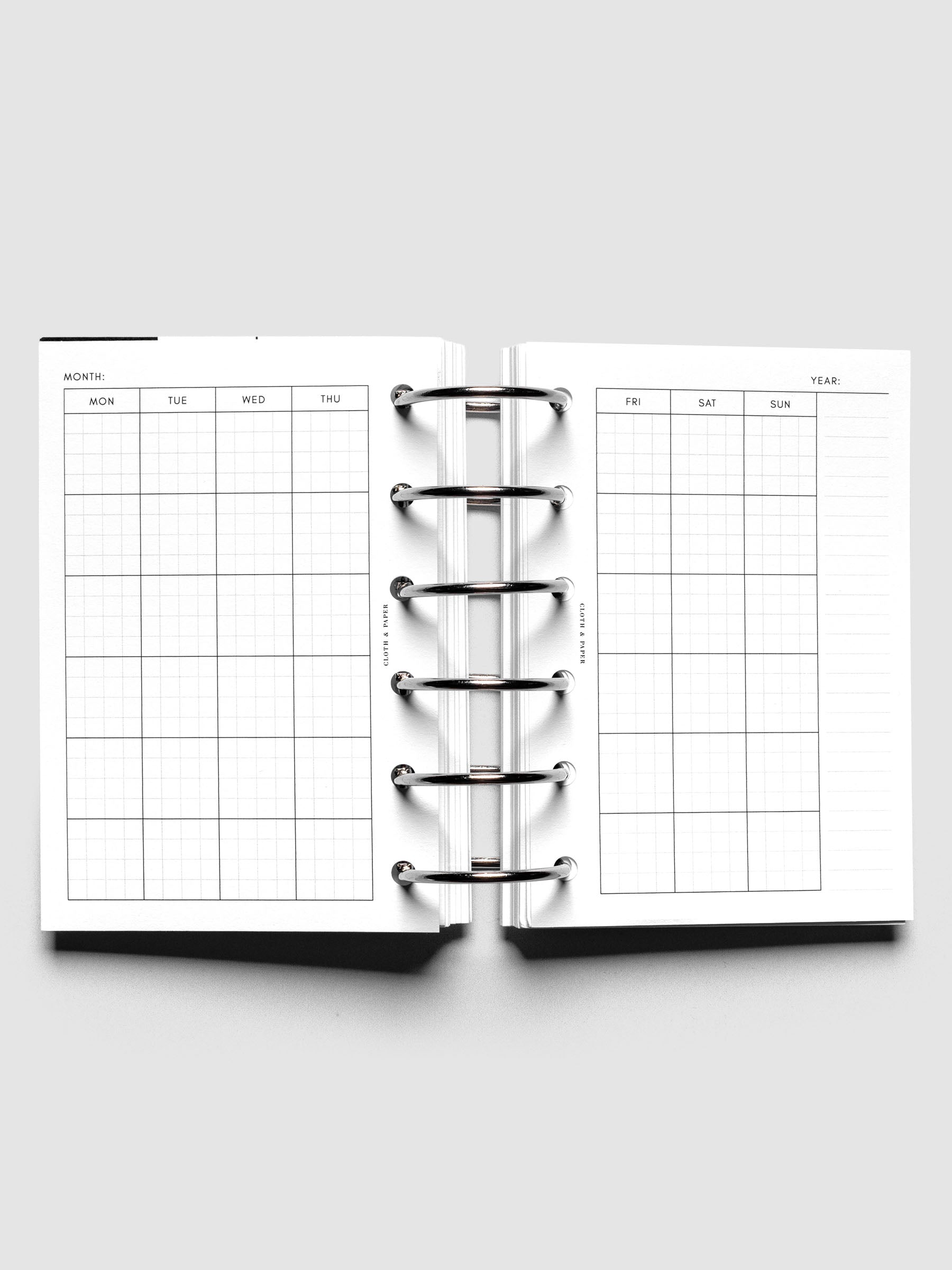 Pocket Monthly Graph Planner Inserts shown ringbound.