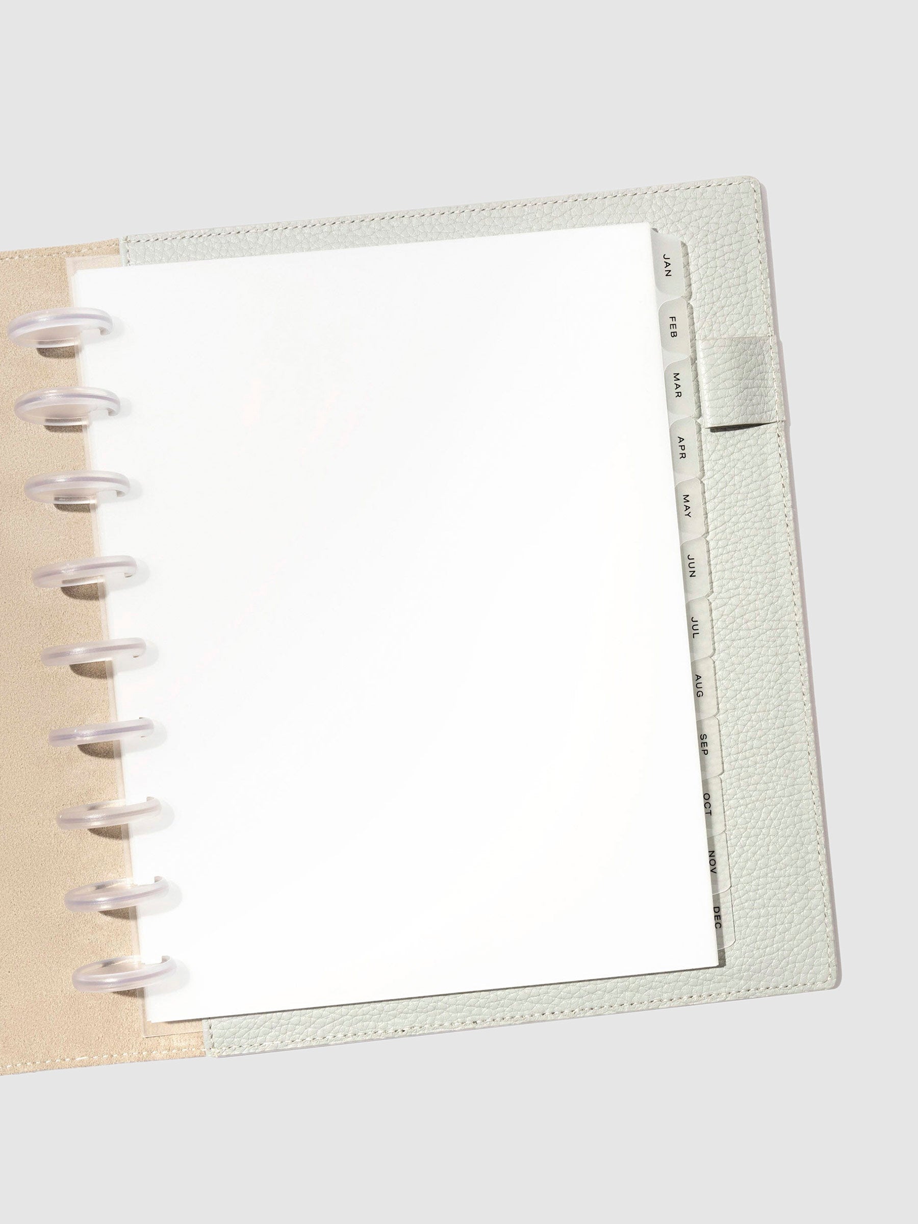 Black foil tabs displayed in use inside a leather folio.